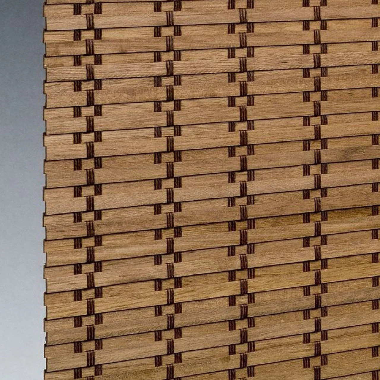 Close-up of a woven wooden surface with a detailed pattern of interlaced strips.