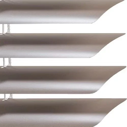 Close-up of horizontal white window blinds with light shining through the gaps.