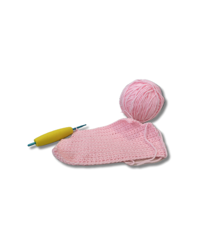 pink yarn ball and crochet piece with yellow and blue crochet hook
