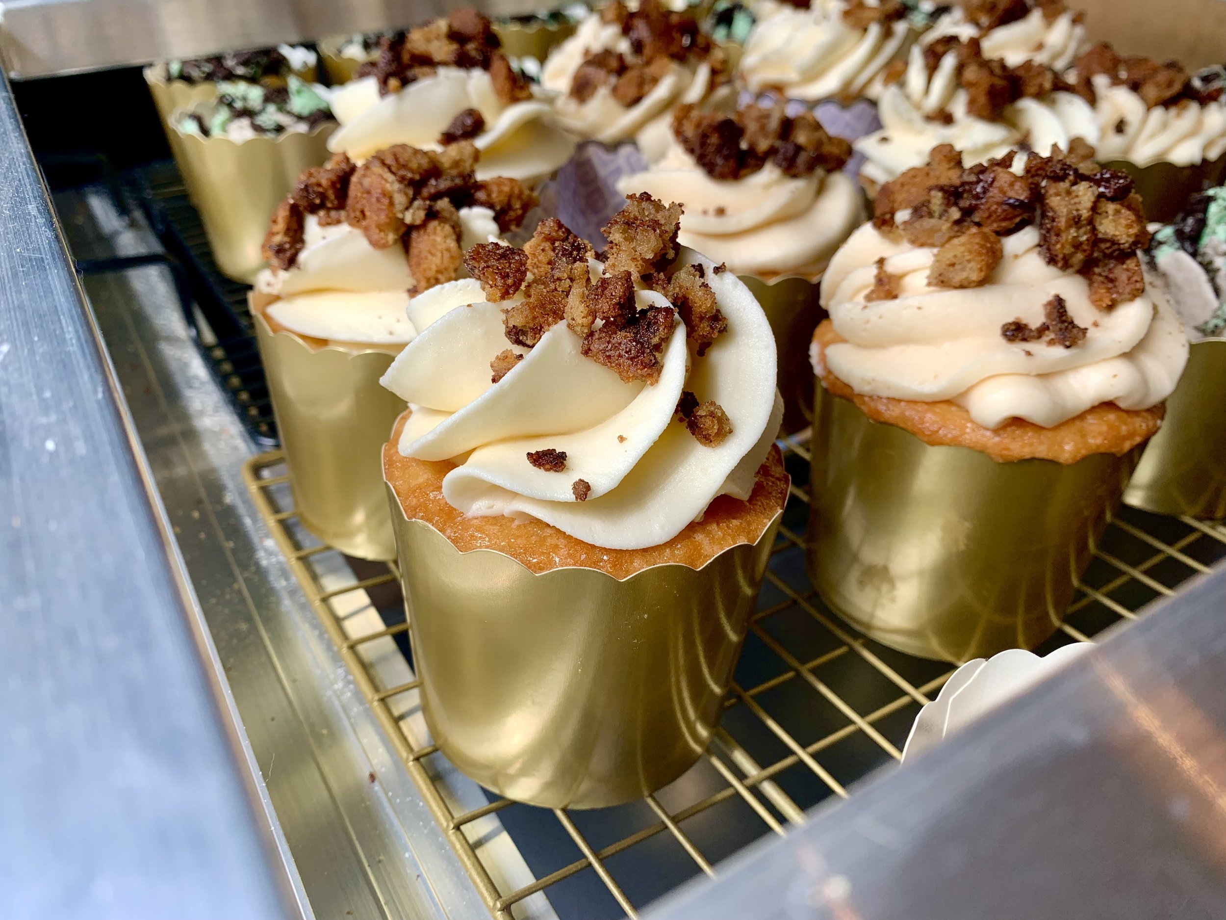 Sea salt chocolate chip cookie cupcakes in gold packaging