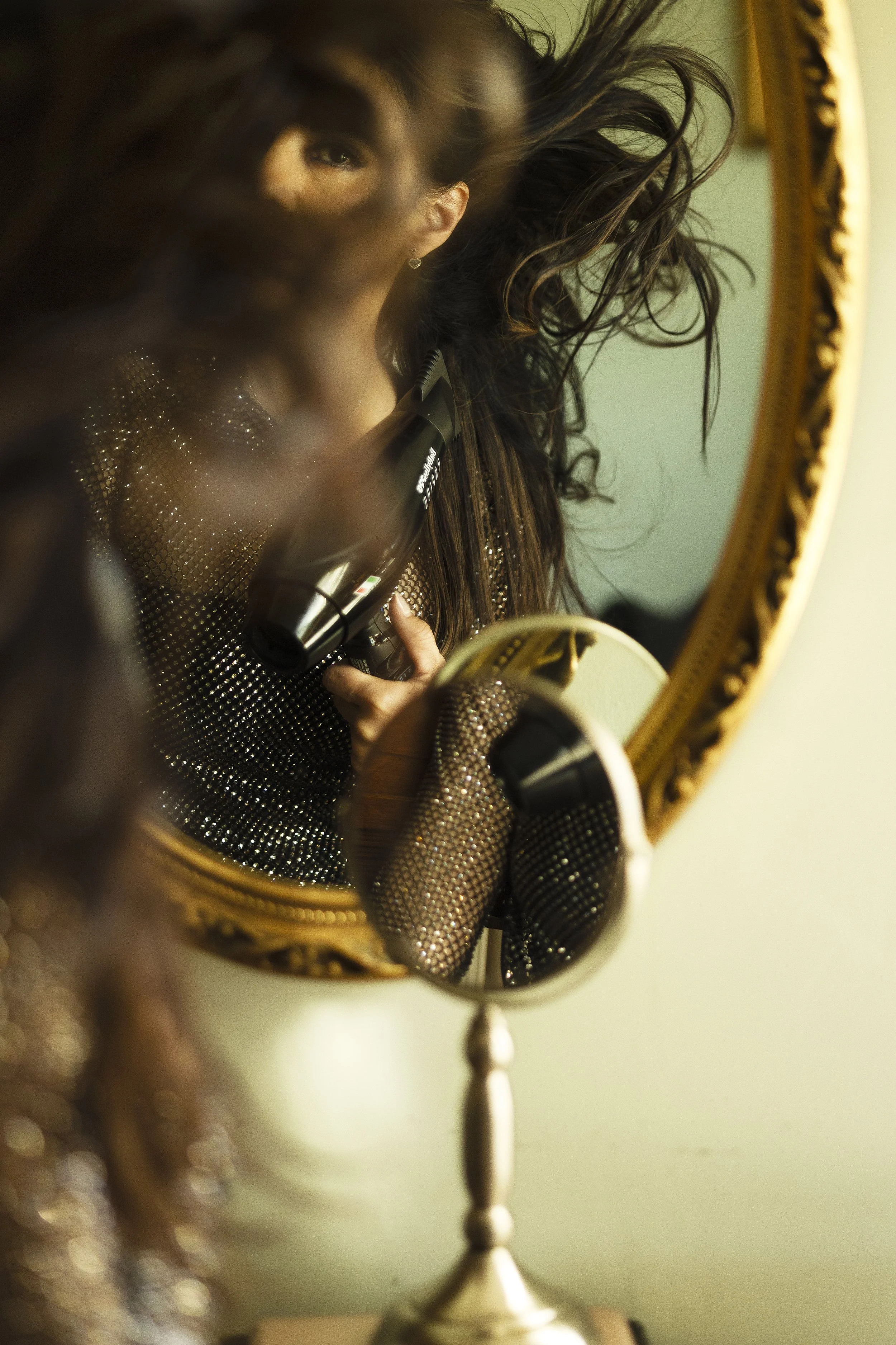 Looking through hair into mirror