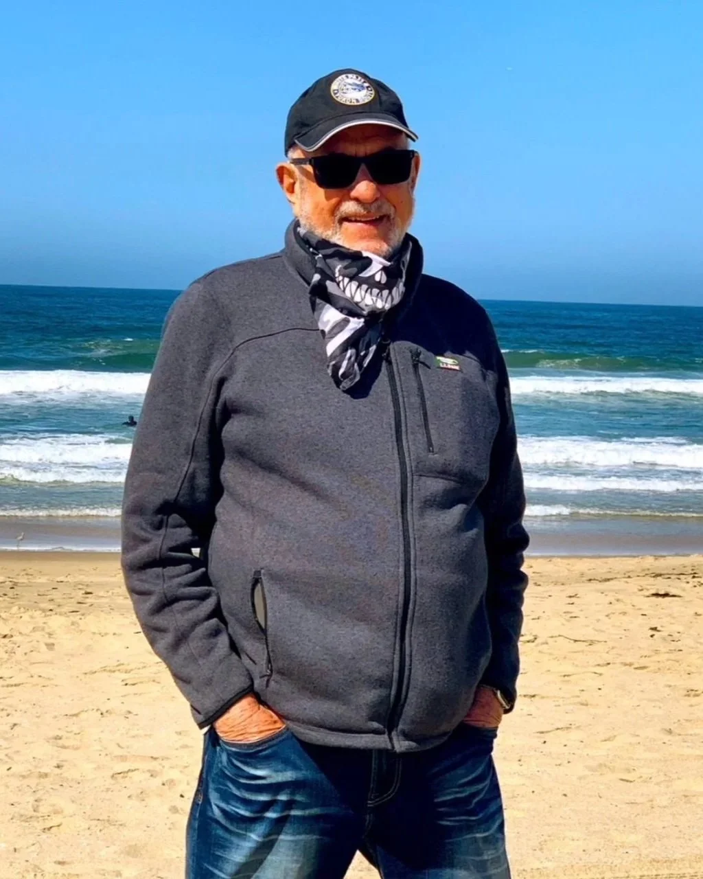 Alan standing by the ocean.