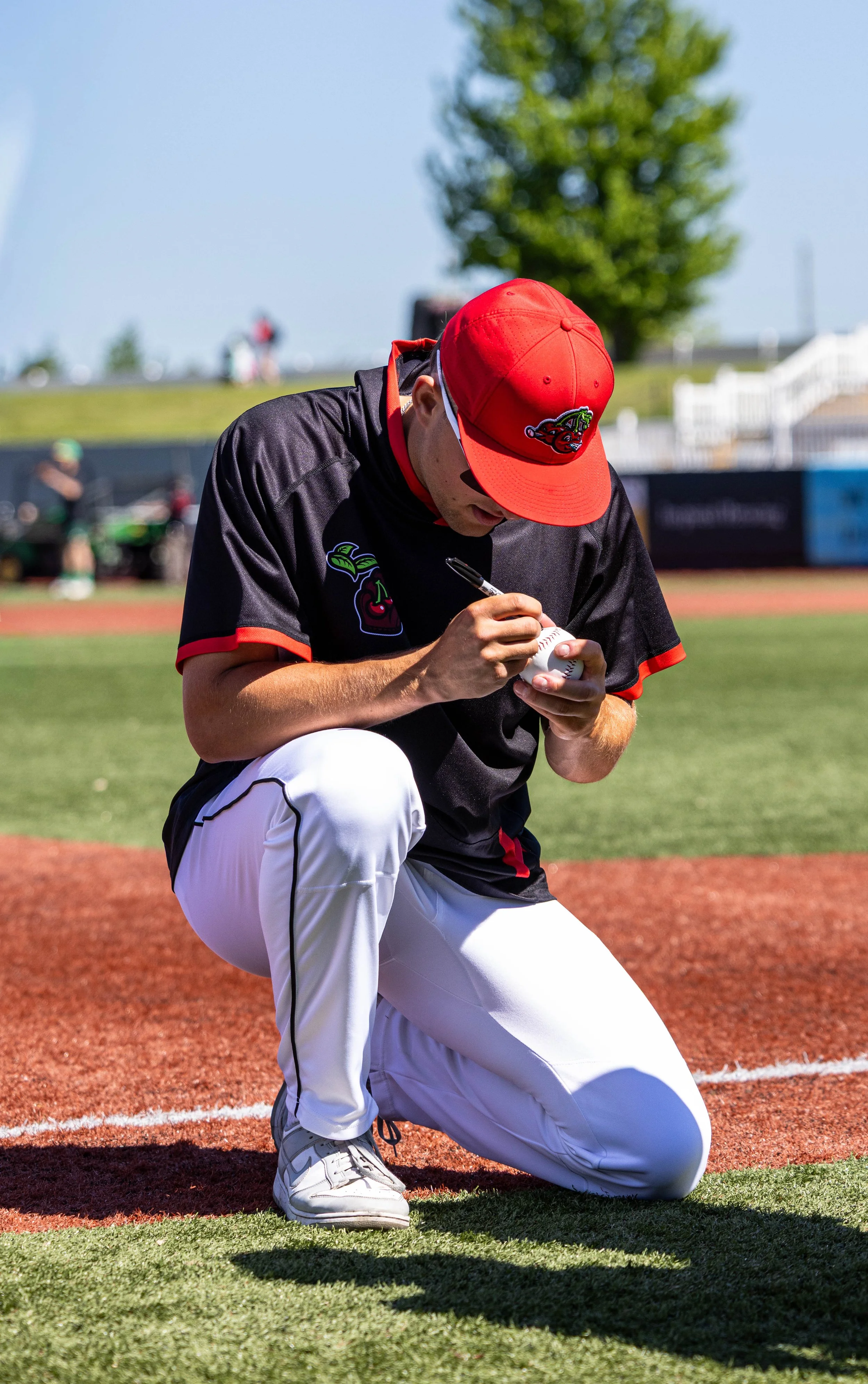 player signing ball.jpg