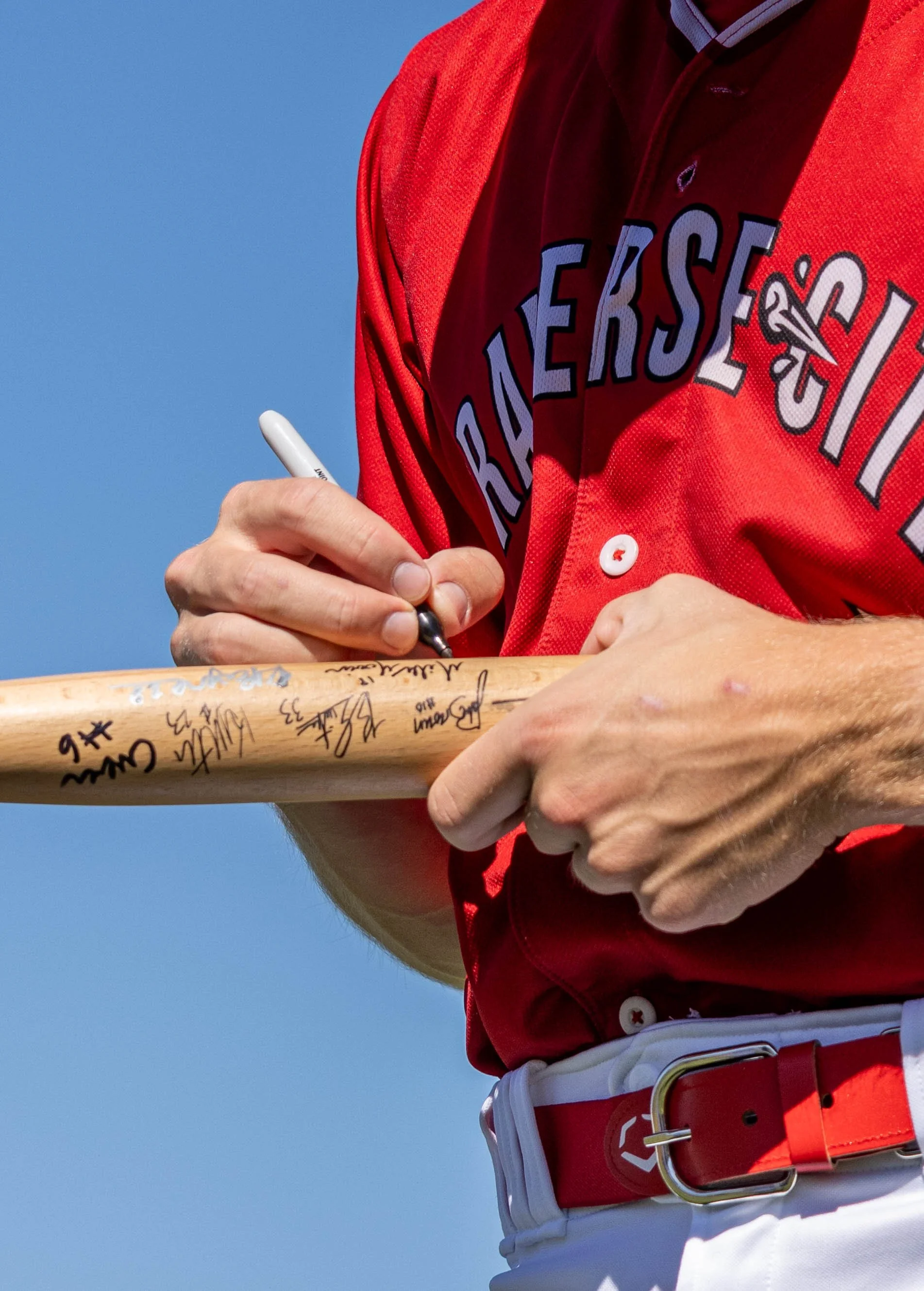 player signing bat close shot.jpg