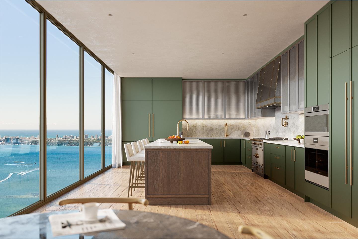 Modern kitchen with green cabinets, marble backsplash, and large floor-to-ceiling windows overlooking a body of water and city skyline.