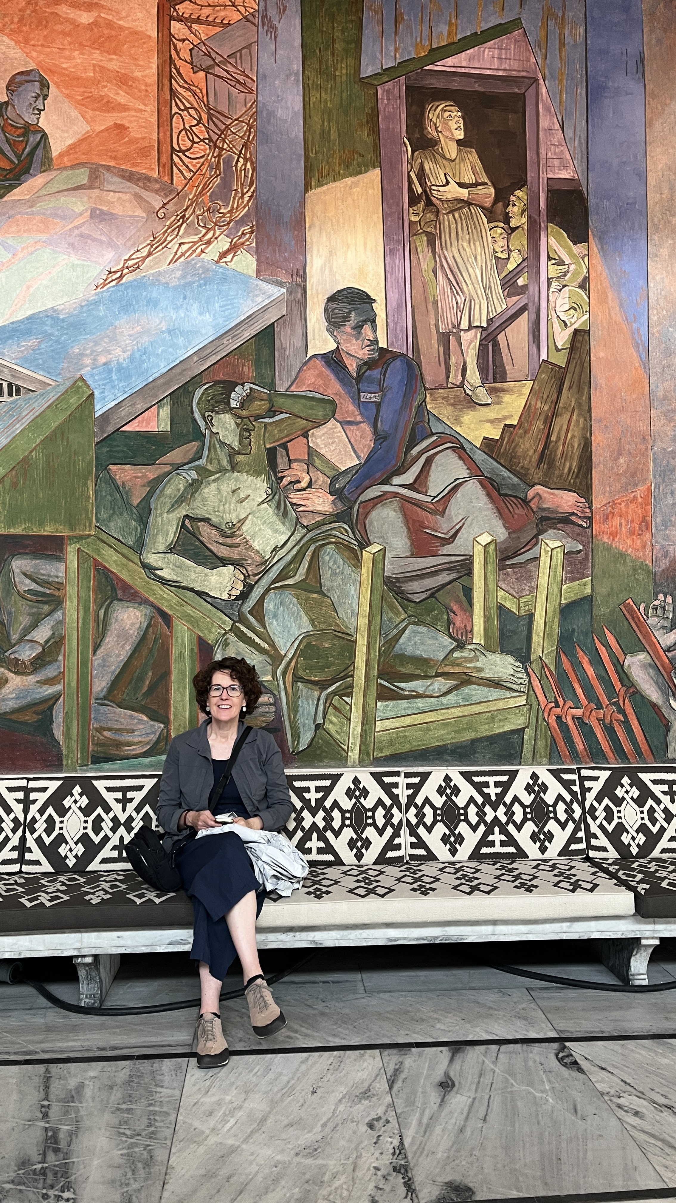 The walls are covered with frescos telling the tale of modern Norway, seemingly.
