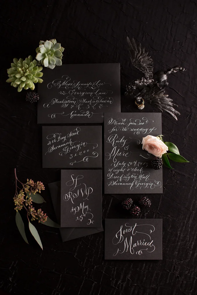 white ink calligraphy on black laura lavender calligraphy