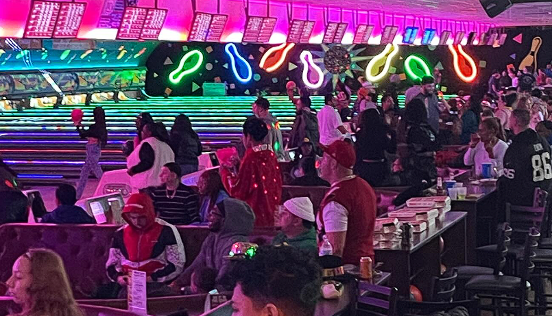Inside Lakewood Lanes, with neon lighting over the lanes
