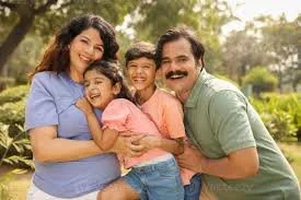 photo of family sitting around a table eating a meal