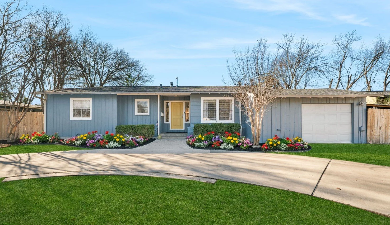 A picture of the front of a newly renovated home ready for a real estate agent to list it for maximum value.