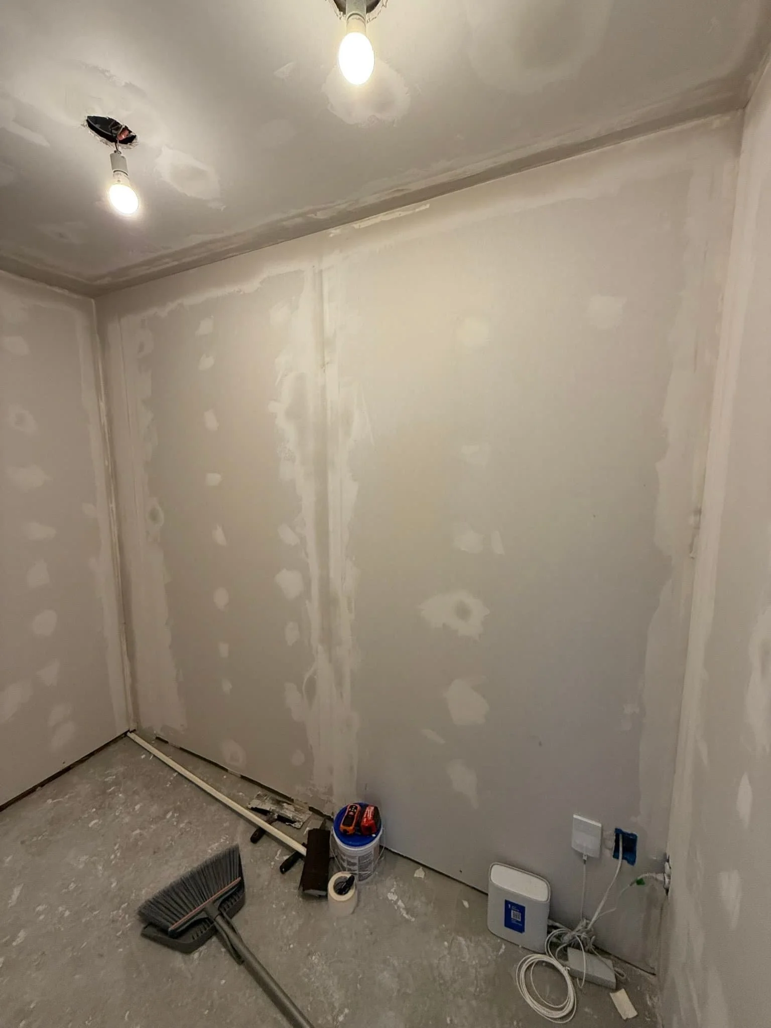 Avanelle Home Renovation hung new drywall to convert this bathroom into a butler pantry.