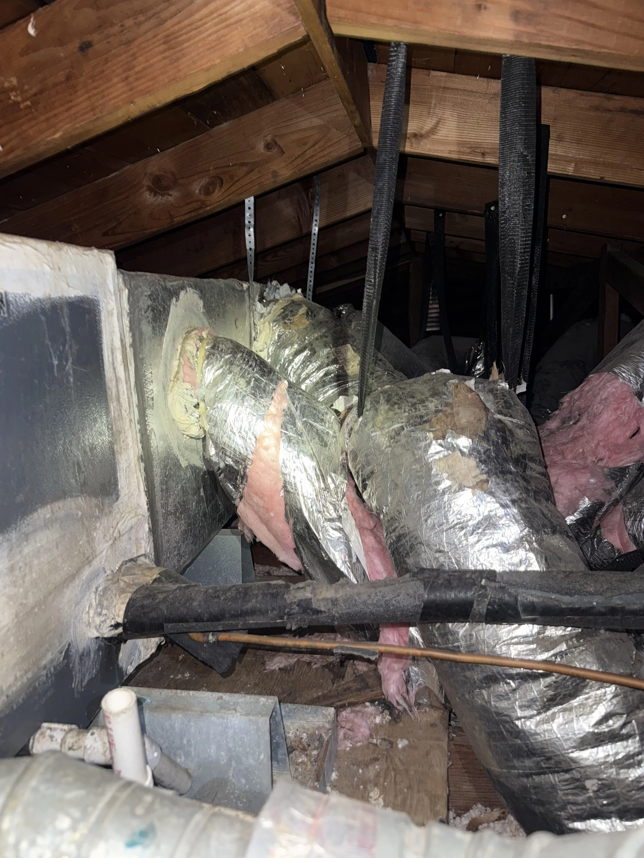 Ductwork Avanelle Cooling & Heating replaced which had been torn up by a racoon in a home's attic space in San Antonio. The old insulation was removed and new blown in as well.