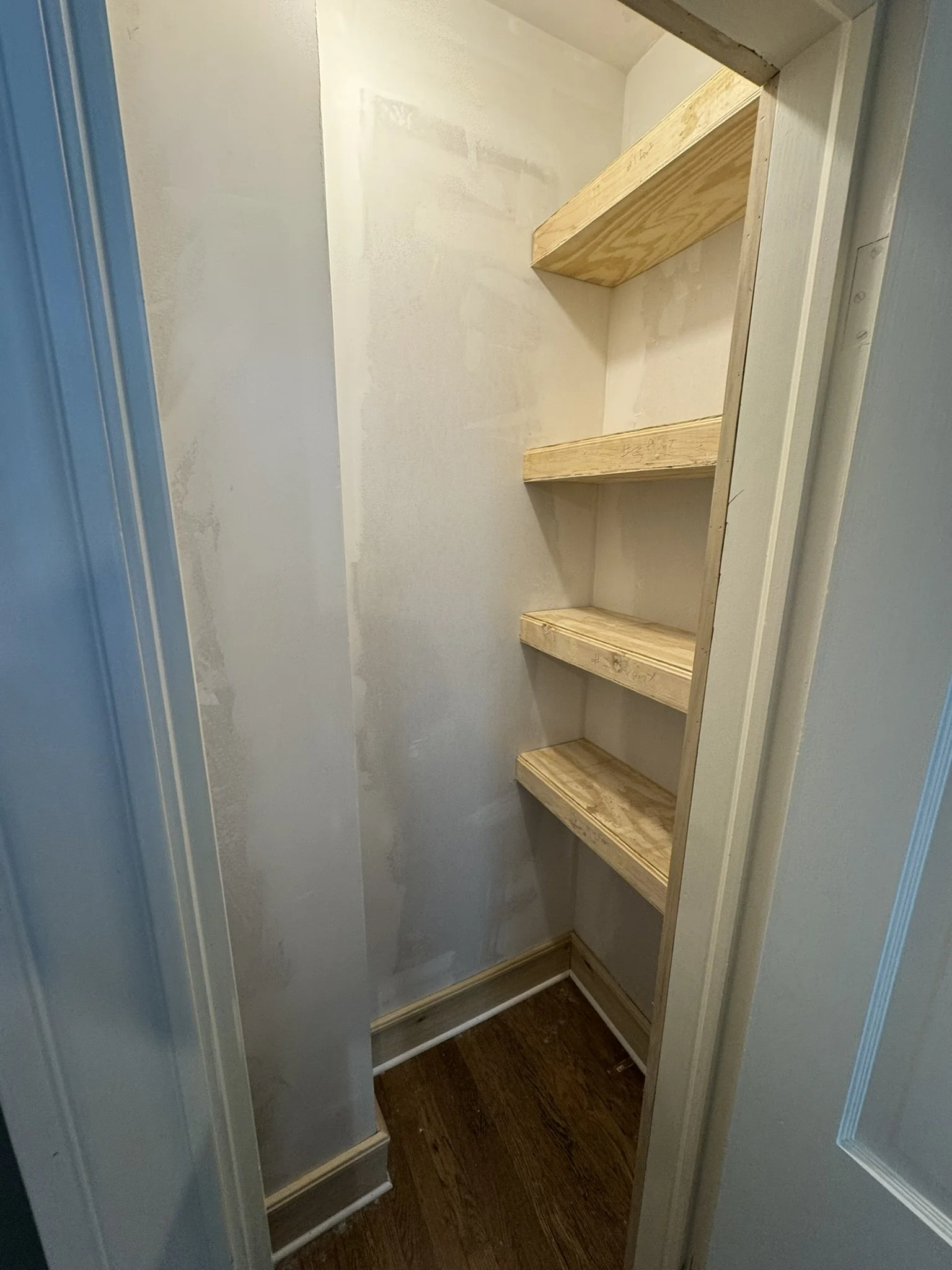 Avanelle Homes renovated this old upstairs closet into a functional guest room storage space at a home in San Antonio, TX.