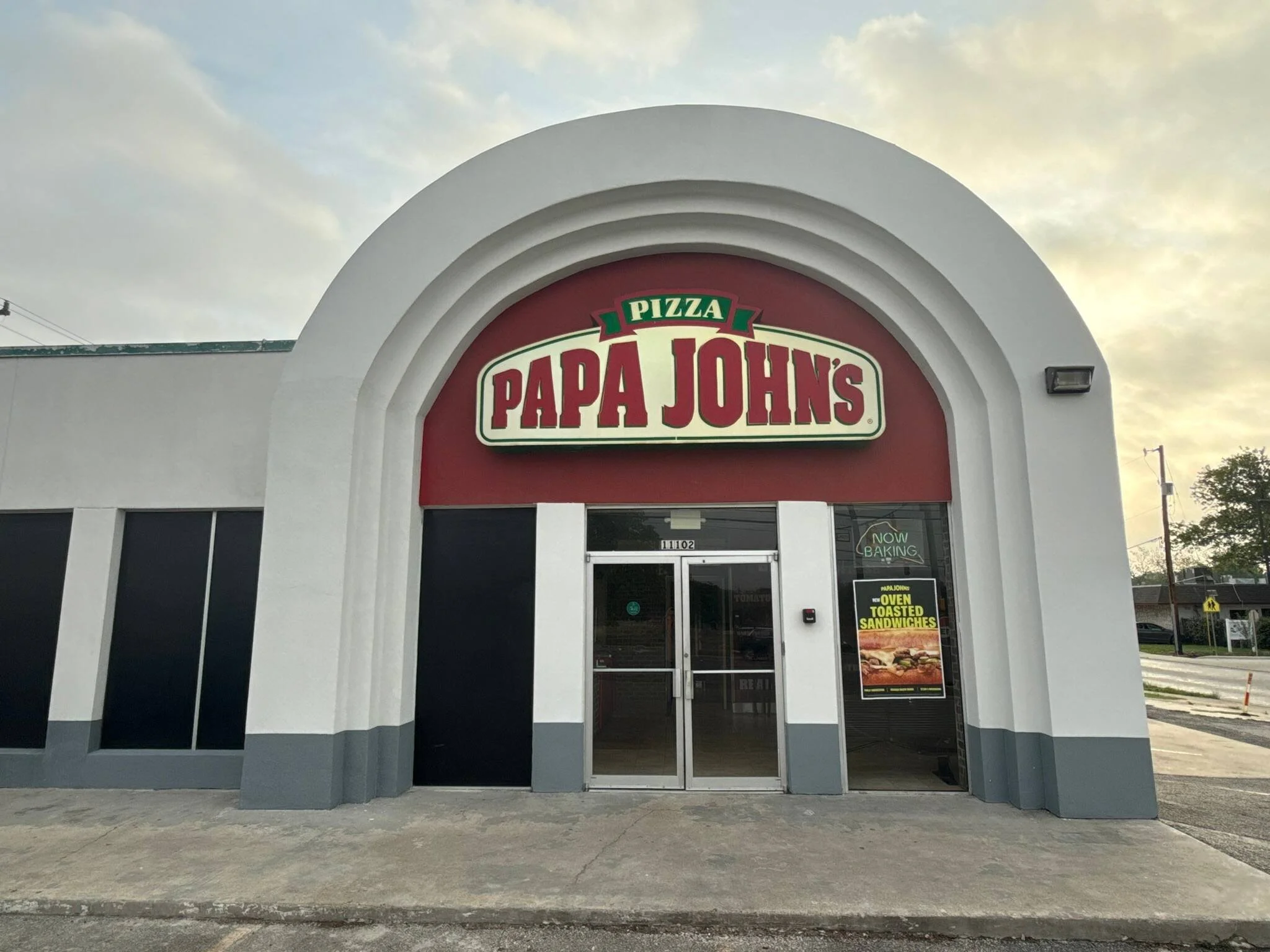 The facade of a pizza store that Avanelle Home Renovation repaired after a car collided with it.