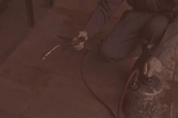 Technician performing proactive maintenance on a house in San Antonio, Texas.