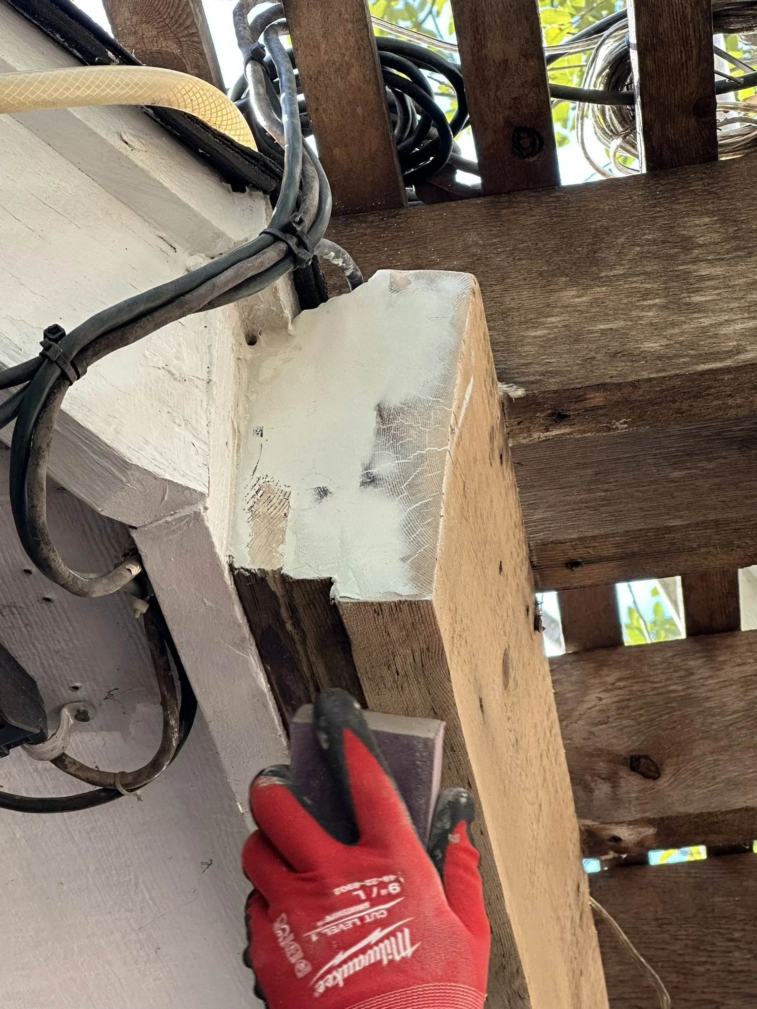 Avanelle Homes repairing some rotted wood in Alamo Heights, TX before the house is listed for sale.