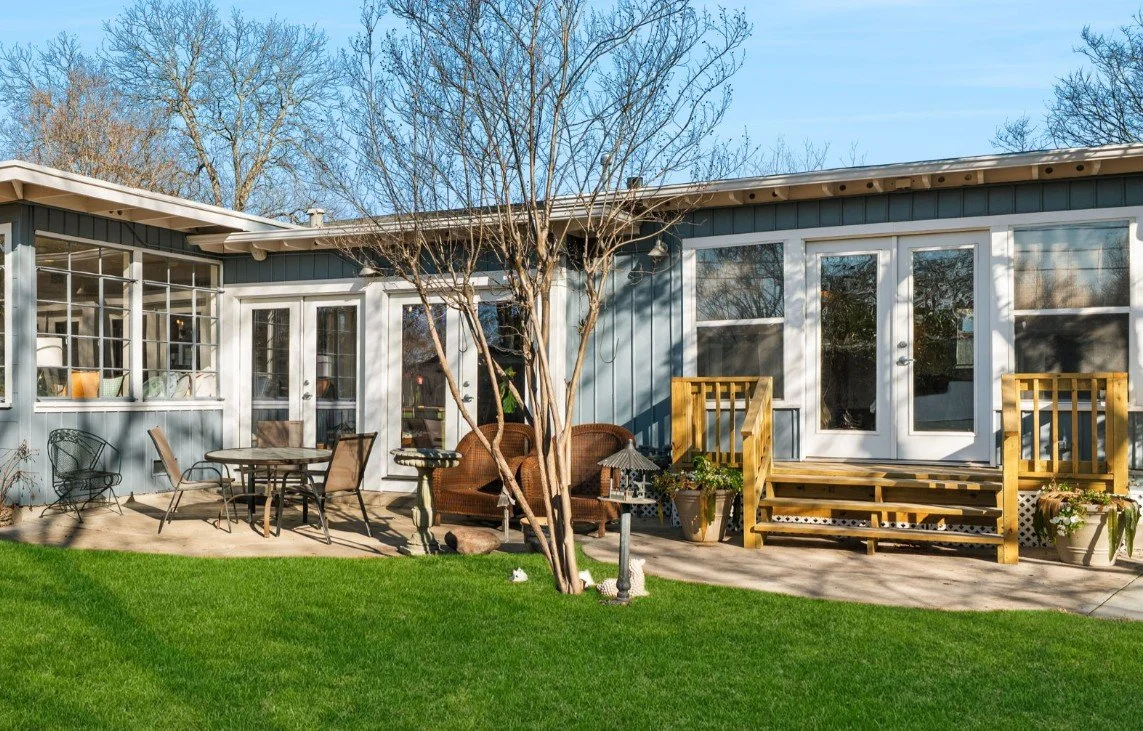 A picture of the back yardof a newly renovated home ready for a real estate agent to list it for maximum value.