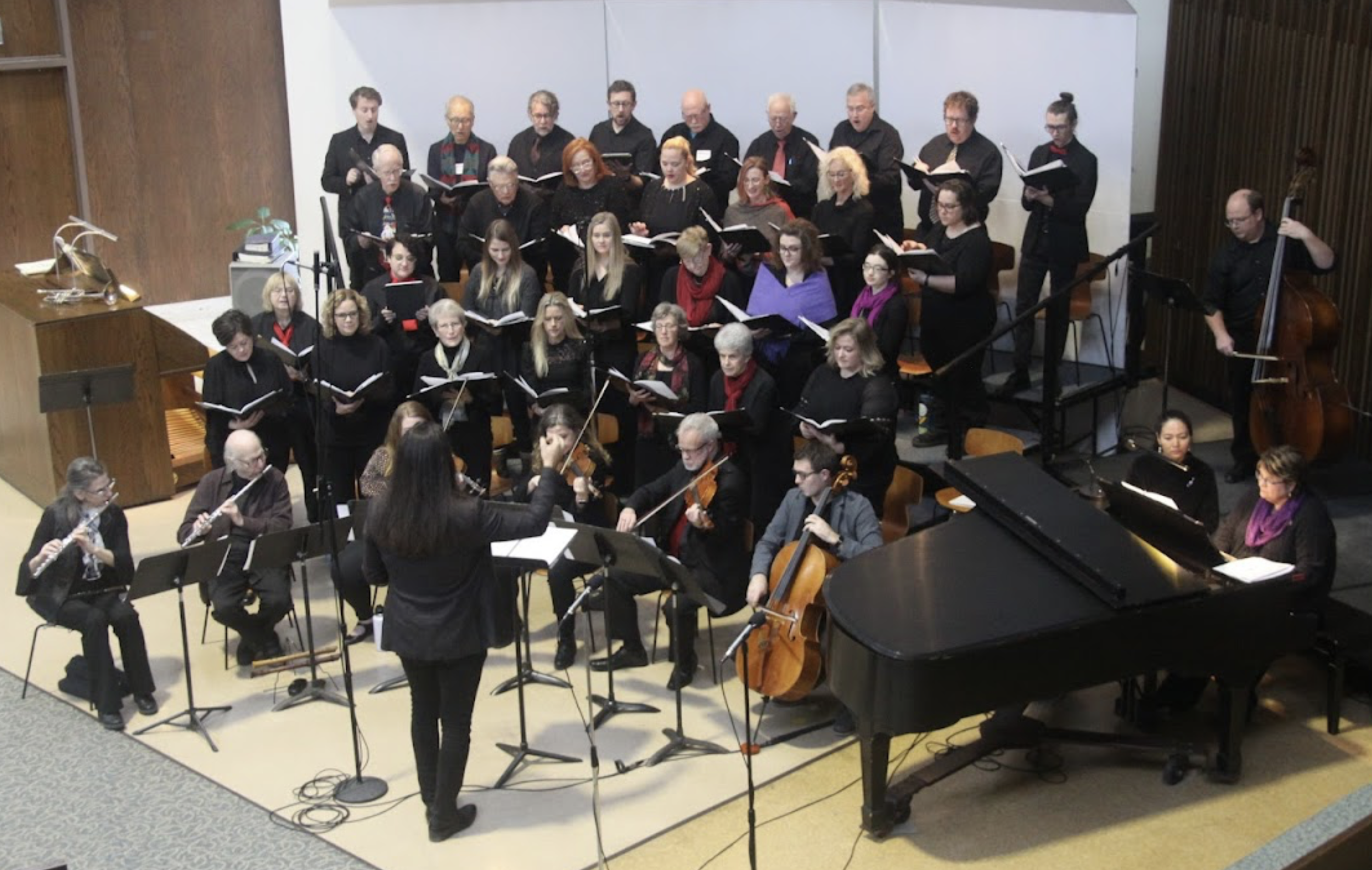 Sanctuary Choir Director, Derek leads both band and singers during a holiday event at First United Methodist Church.
