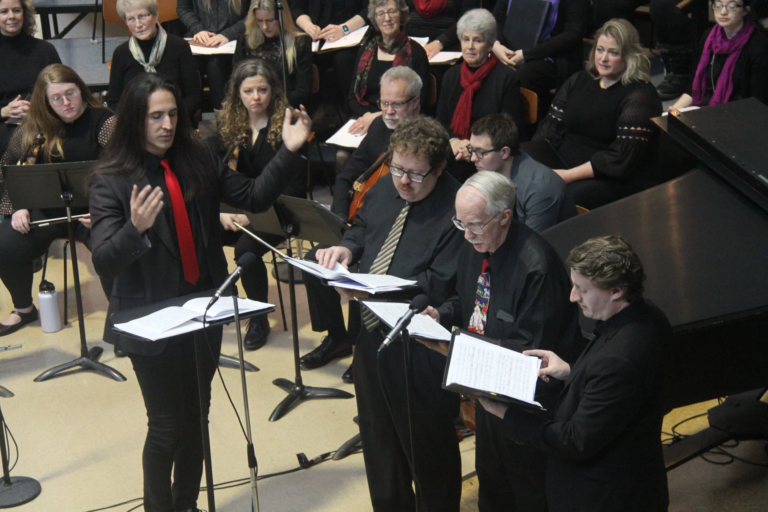 Sanctuary Choir Director Derek B. conducting the choir during a holiday musical performance.