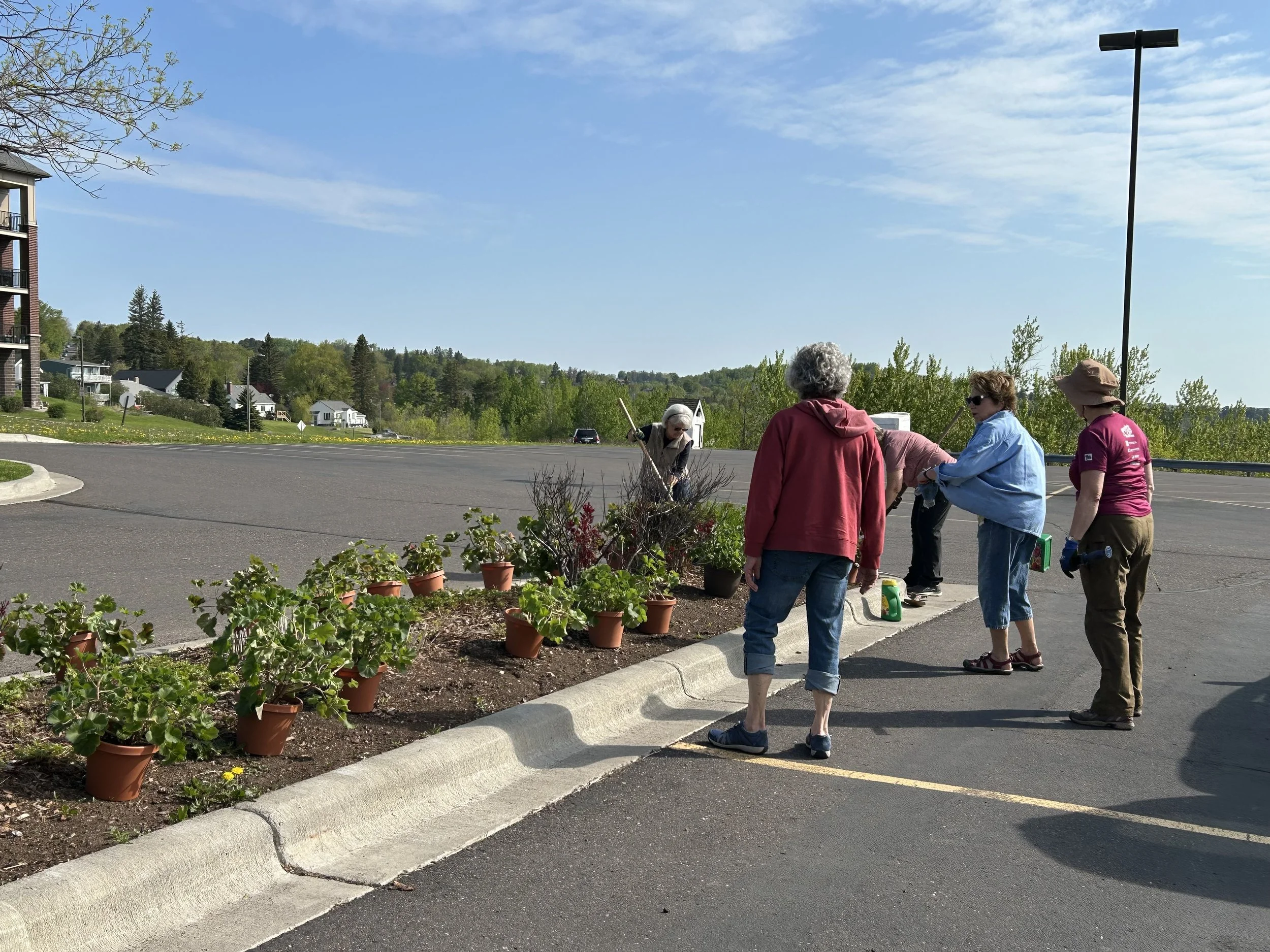 Volunteers planting geraniums at First United Methodist Church.