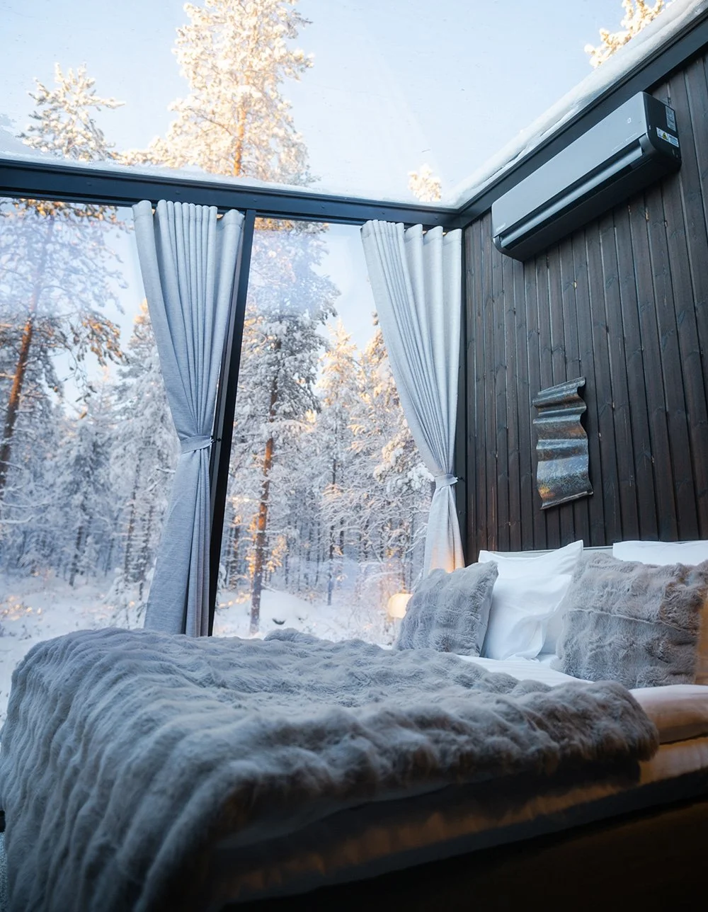Glass walled bedroom at Haloo Igloos, spot Aurora Borealis