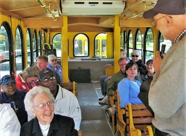 Group of neighbors on a trolley touring Millersville neighborhood