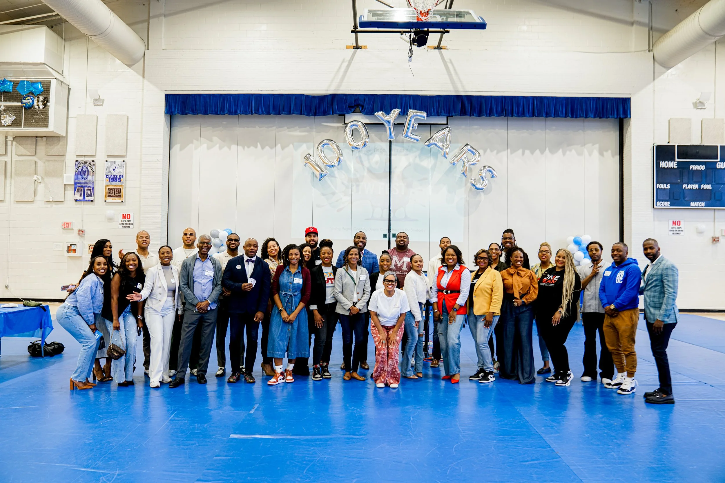 Panel members and speakers with Page Turners Make Great Learners at the Booker T. Washington 100 Year Anniversary event.