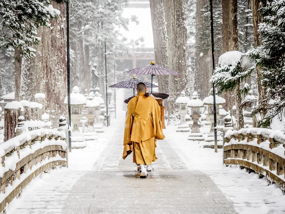 Buddhist monks in snowy Koyasan, Japan