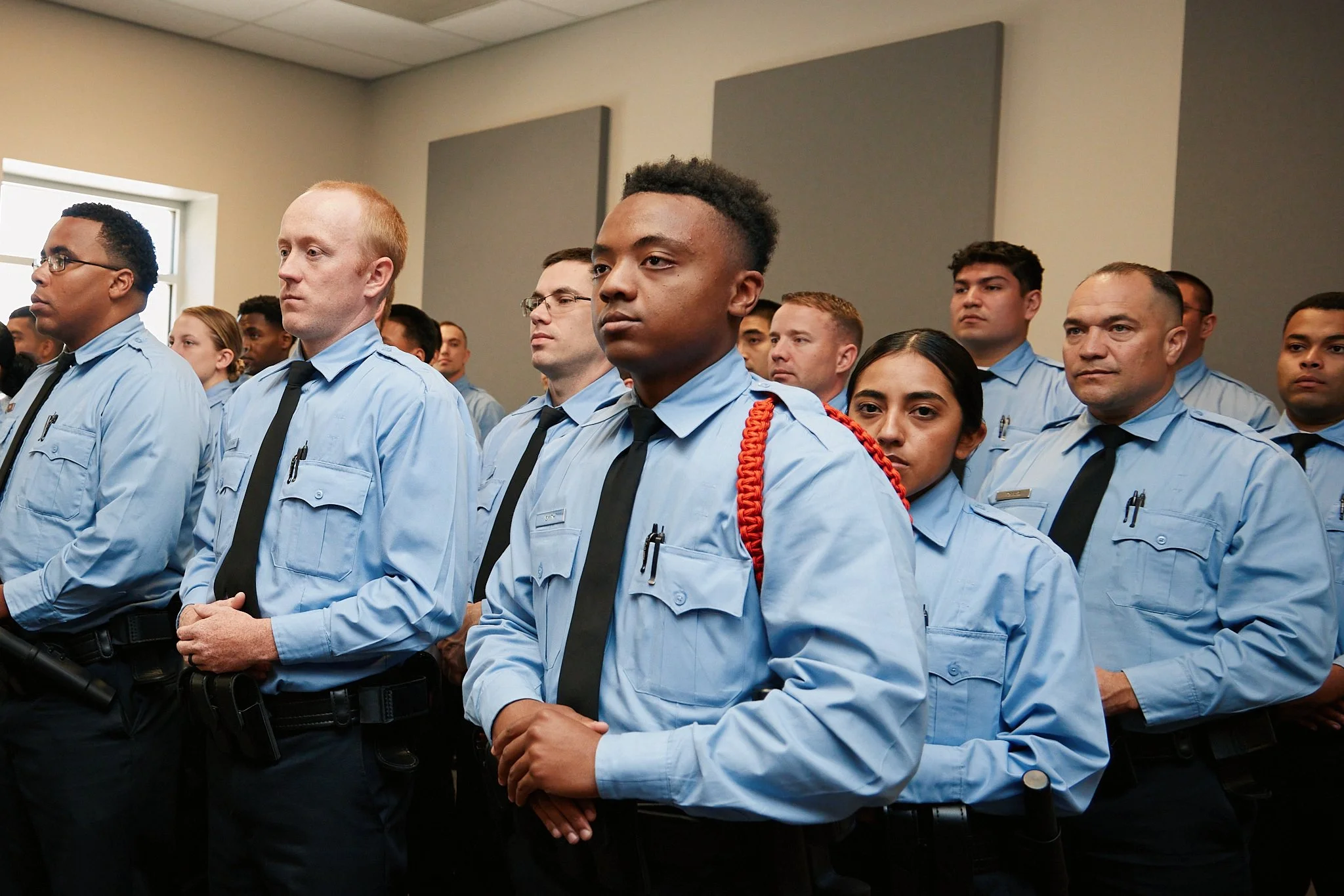 Group of police officers standing in uniform during a formal ceremony.