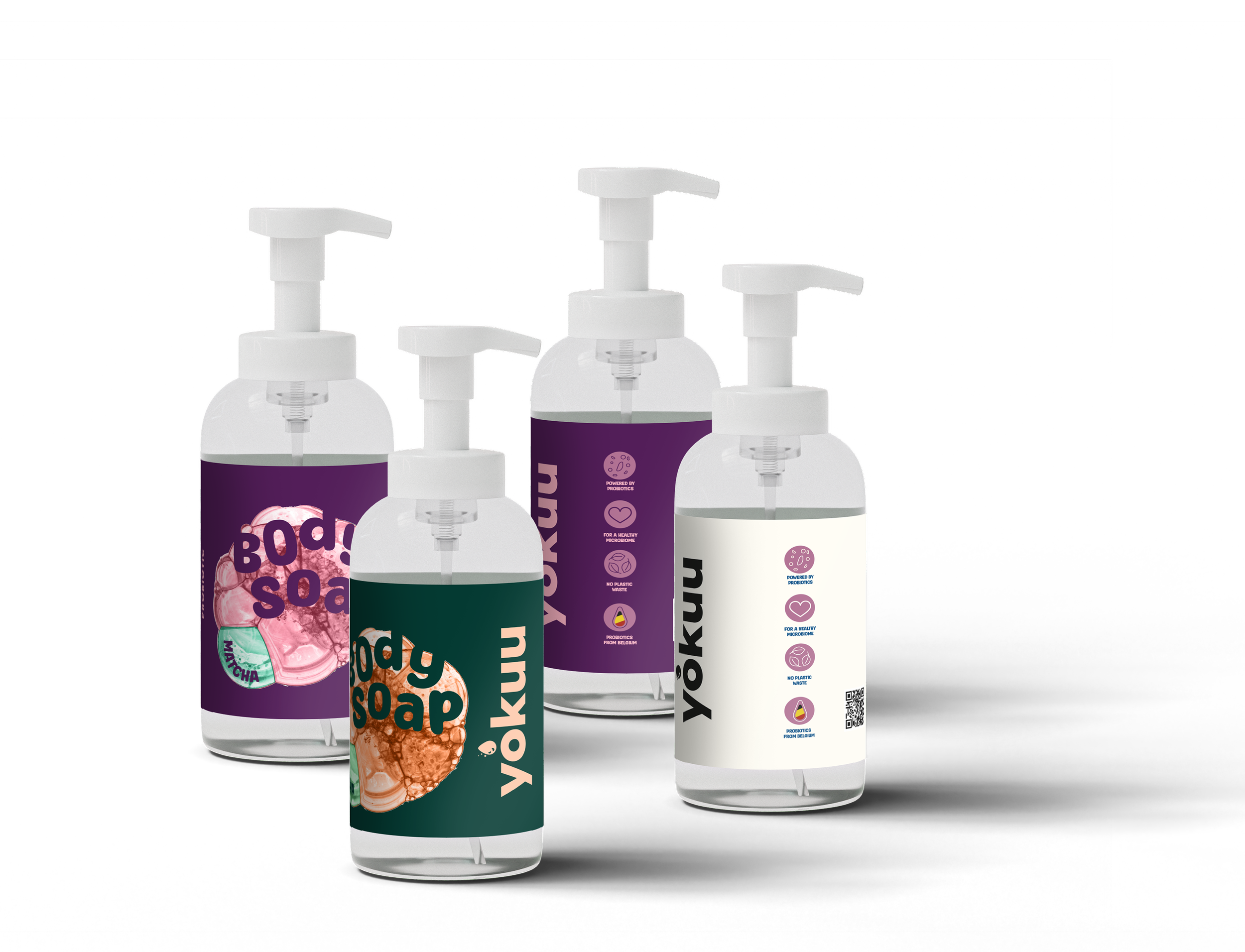 Four bottles of liquid soap with pump dispensers, labeled with colorful designs and text.
