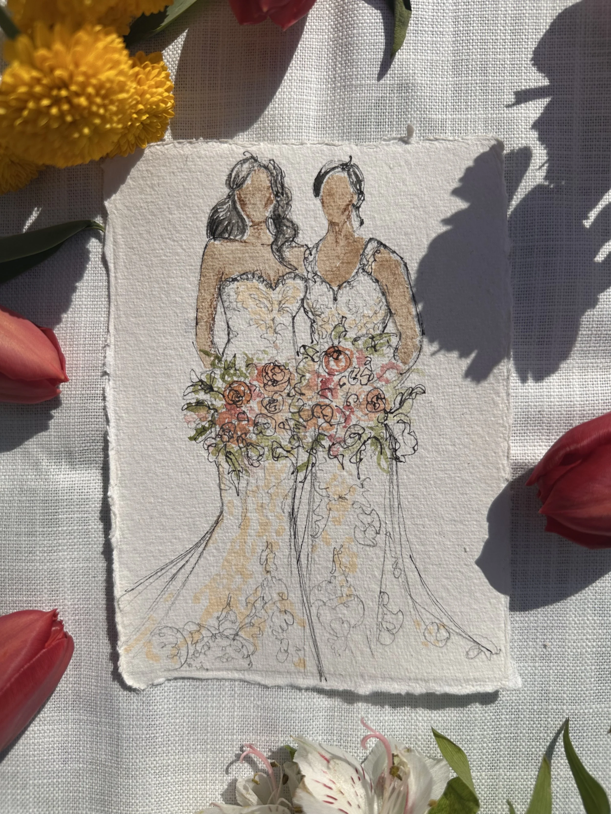 A watercolor illustration of two women in wedding dresses holding bouquets, surrounded by flowers, on textured paper.