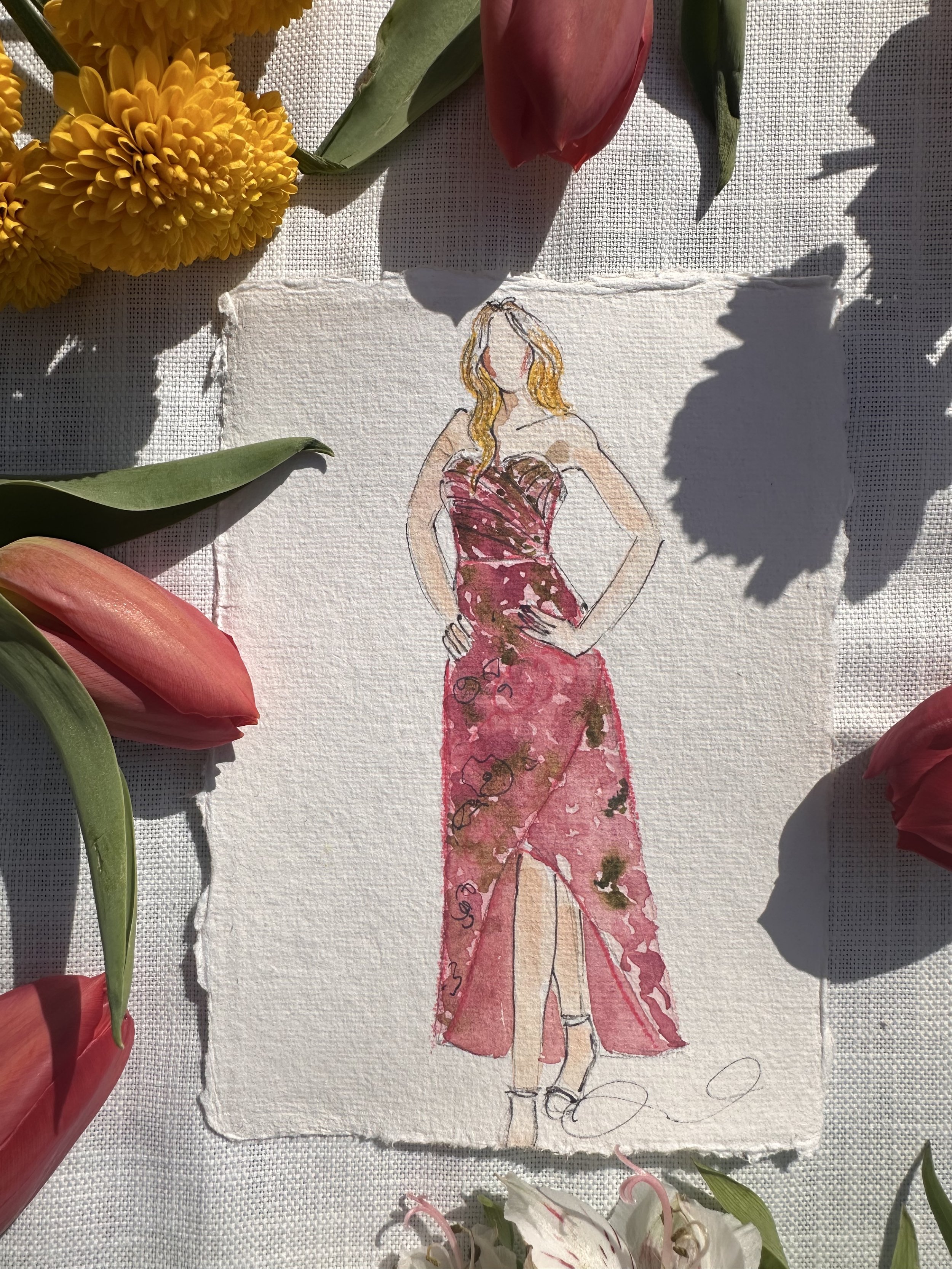 Hand-drawn illustration of a woman in a pink floral dress with a slit, standing with one hand on her hip, surrounded by flowers.
