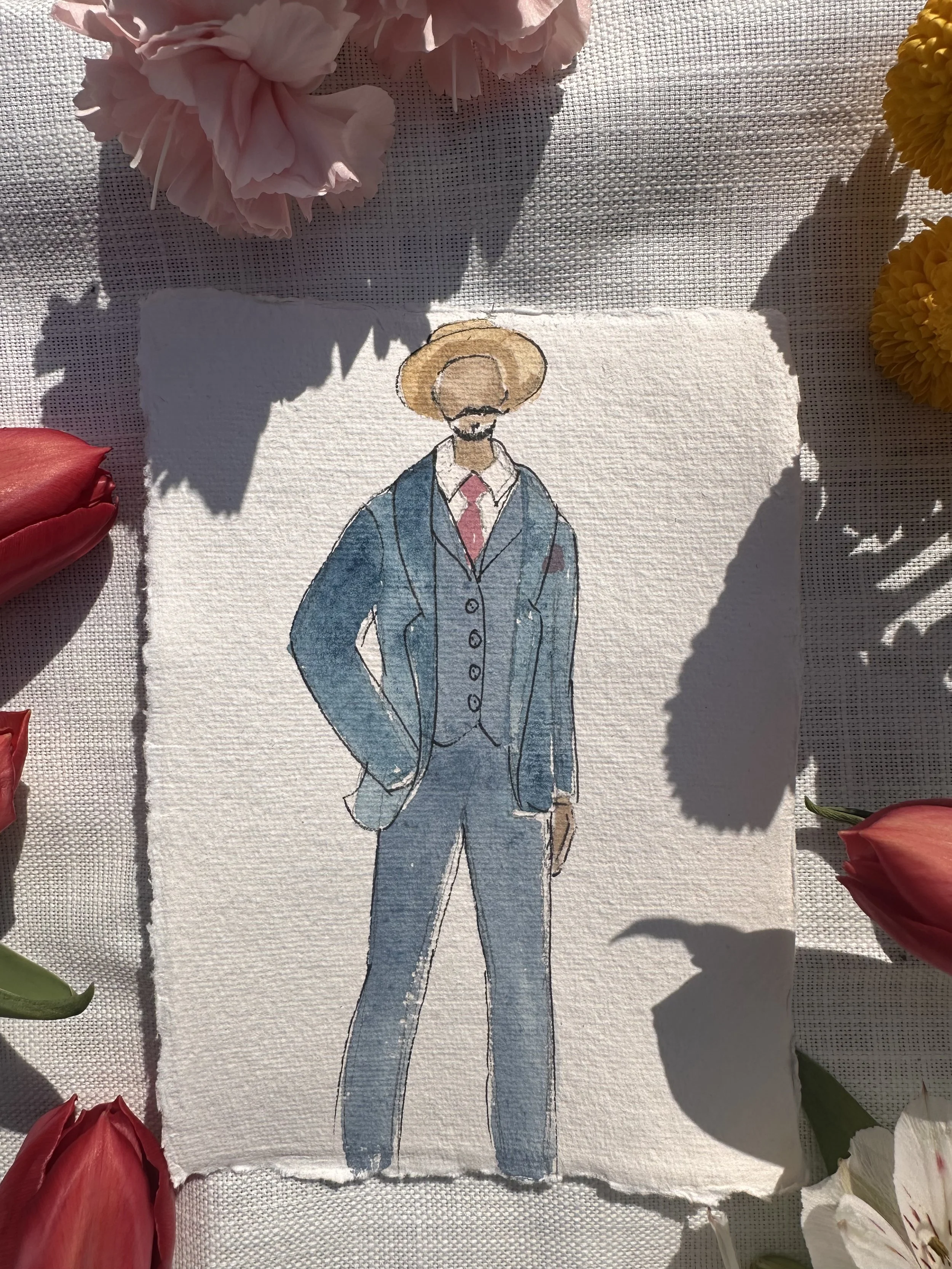 A watercolor sketch of a man in a suit with a tie, wearing a wide-brimmed hat, on textured paper surrounded by pink, red, and yellow flowers.