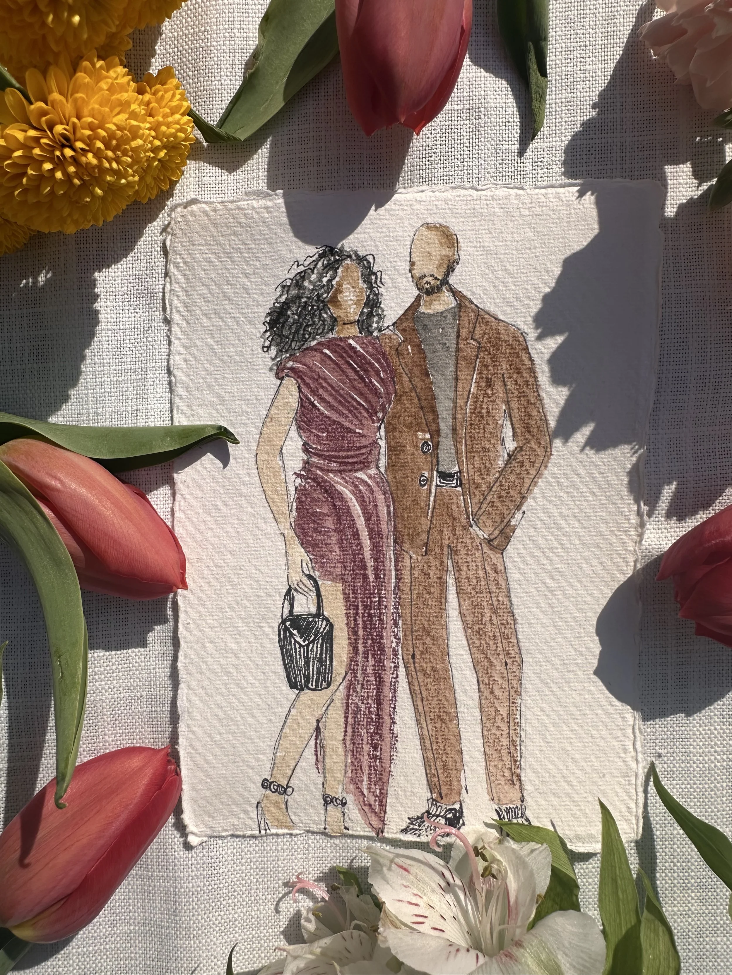 A watercolor illustration of a woman in a burgundy dress and a man in a brown suit standing together, surrounded by flowers.