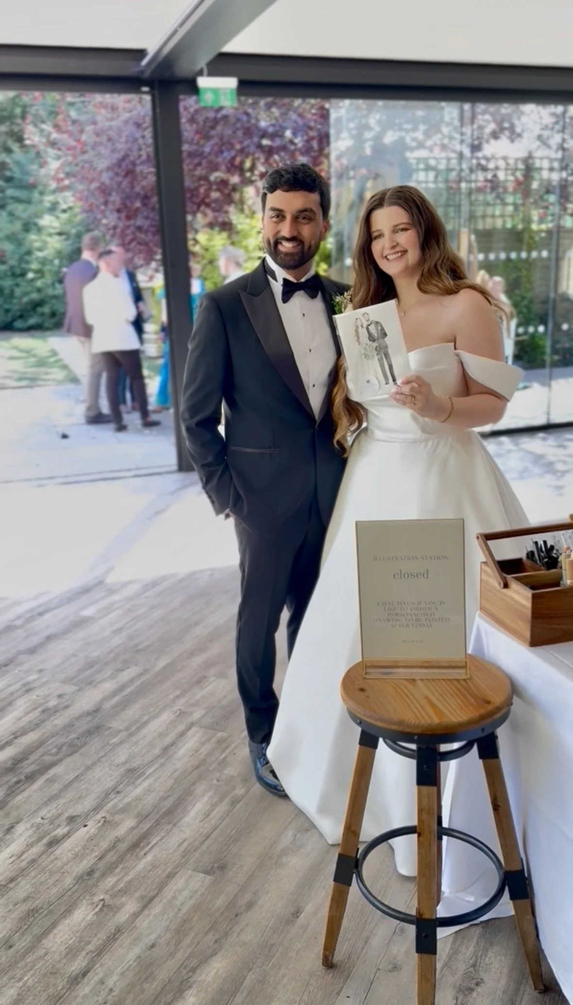 Bride and Groom with their finished live illustration