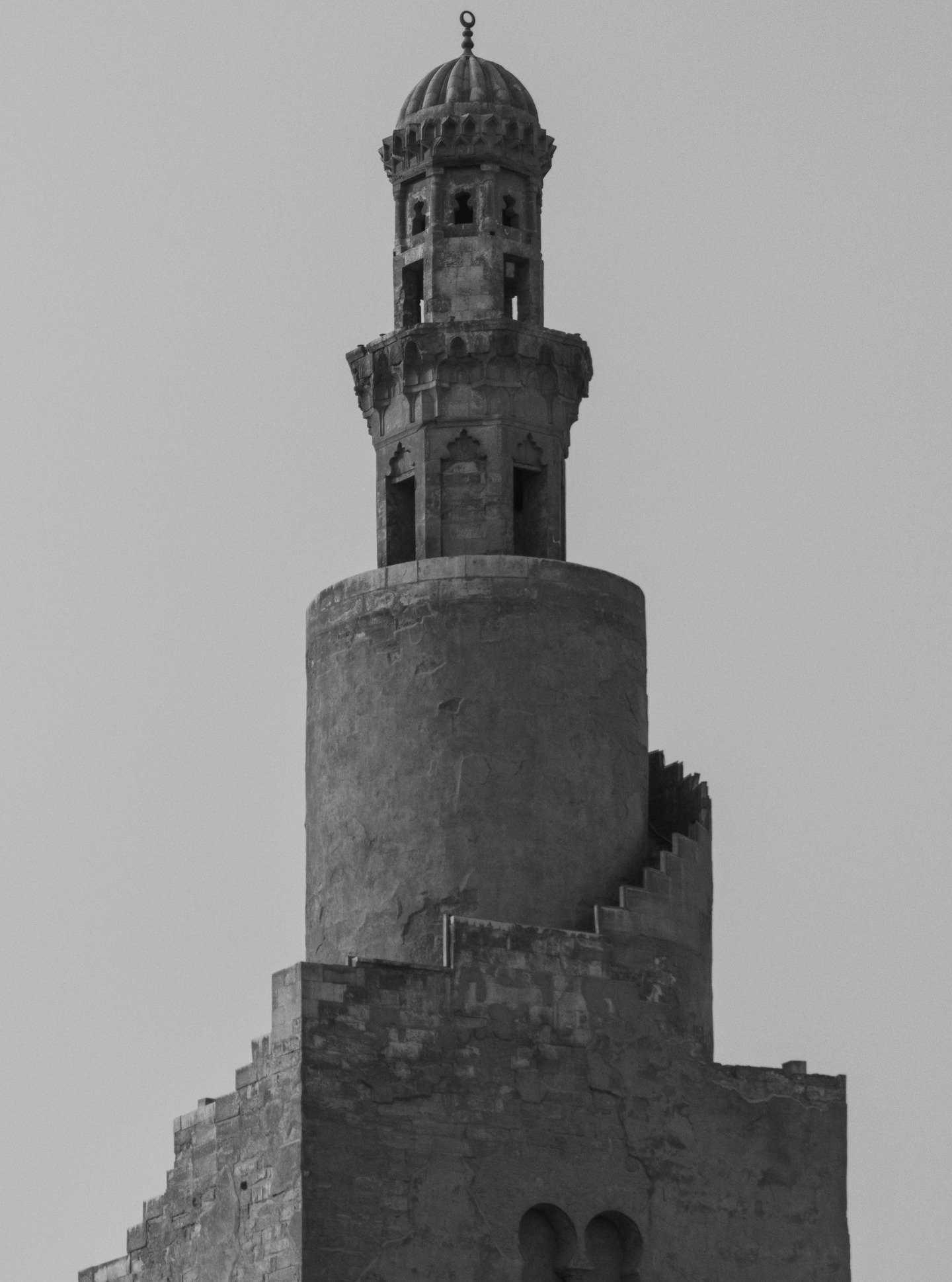Cairo has hundreds of minarets. Only Ibn Tulun's spirals, modeled on a mosque in Iraq, built in 879 CE, and still the only one of its kind in the city. Inside, every arch, soffit, and prayer niche is carved stucco, no tiles or mosaics anywhere.

Read