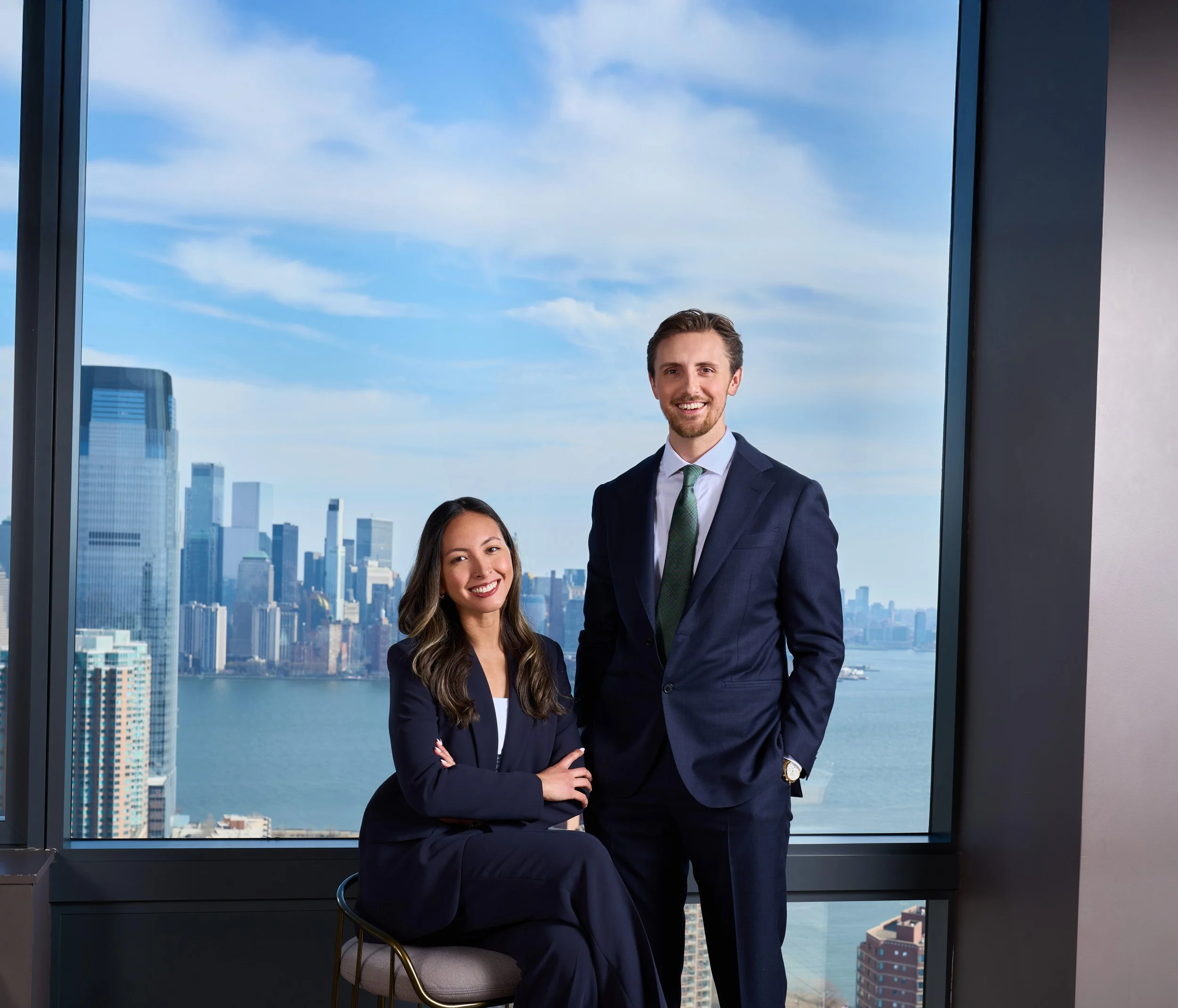 Ruth and Jonathan Grogan with the Manhattan skyline behind them.