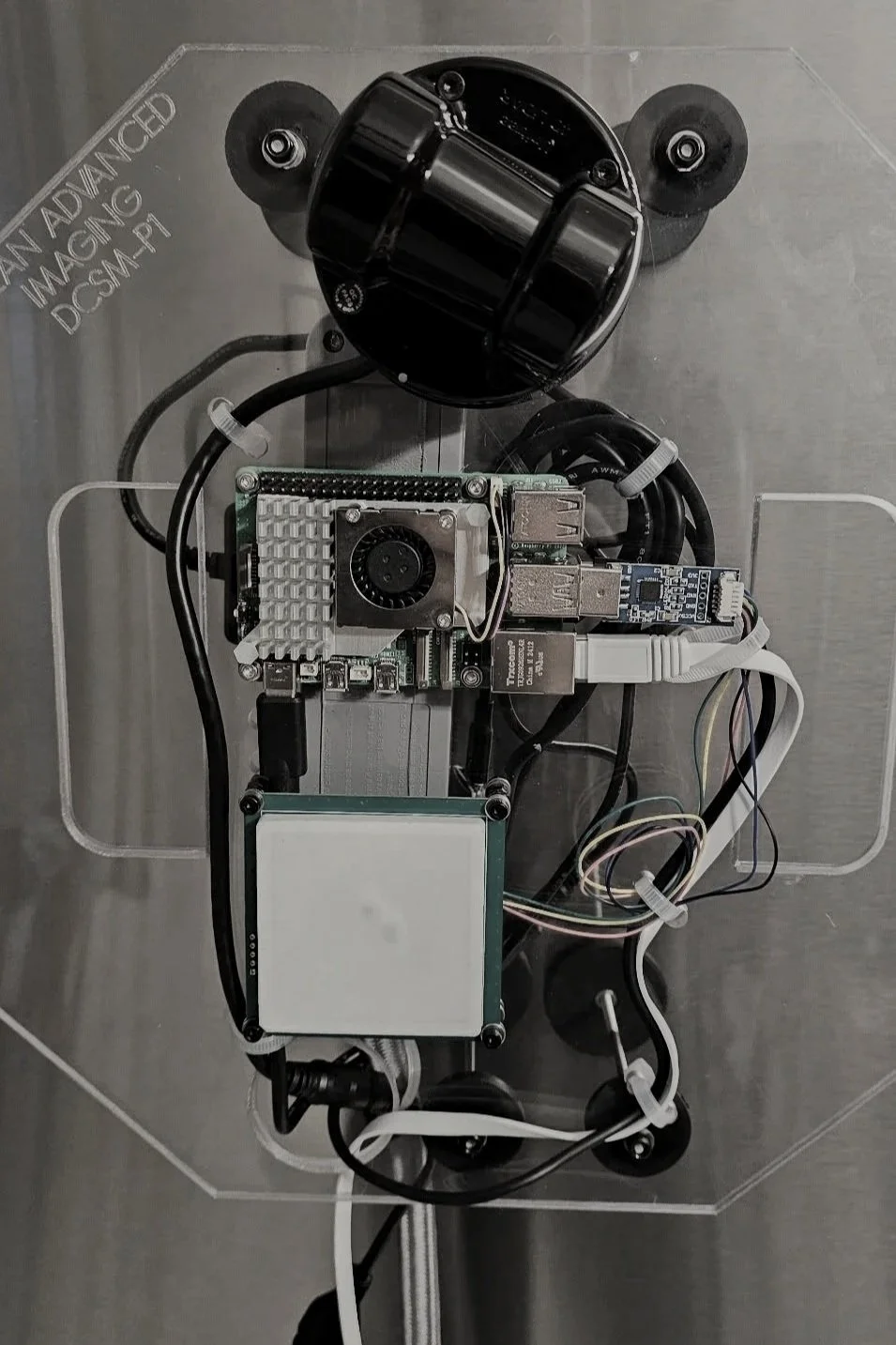 Mounting plate with electronics for an oil and gas R&D monitoring system prototype.