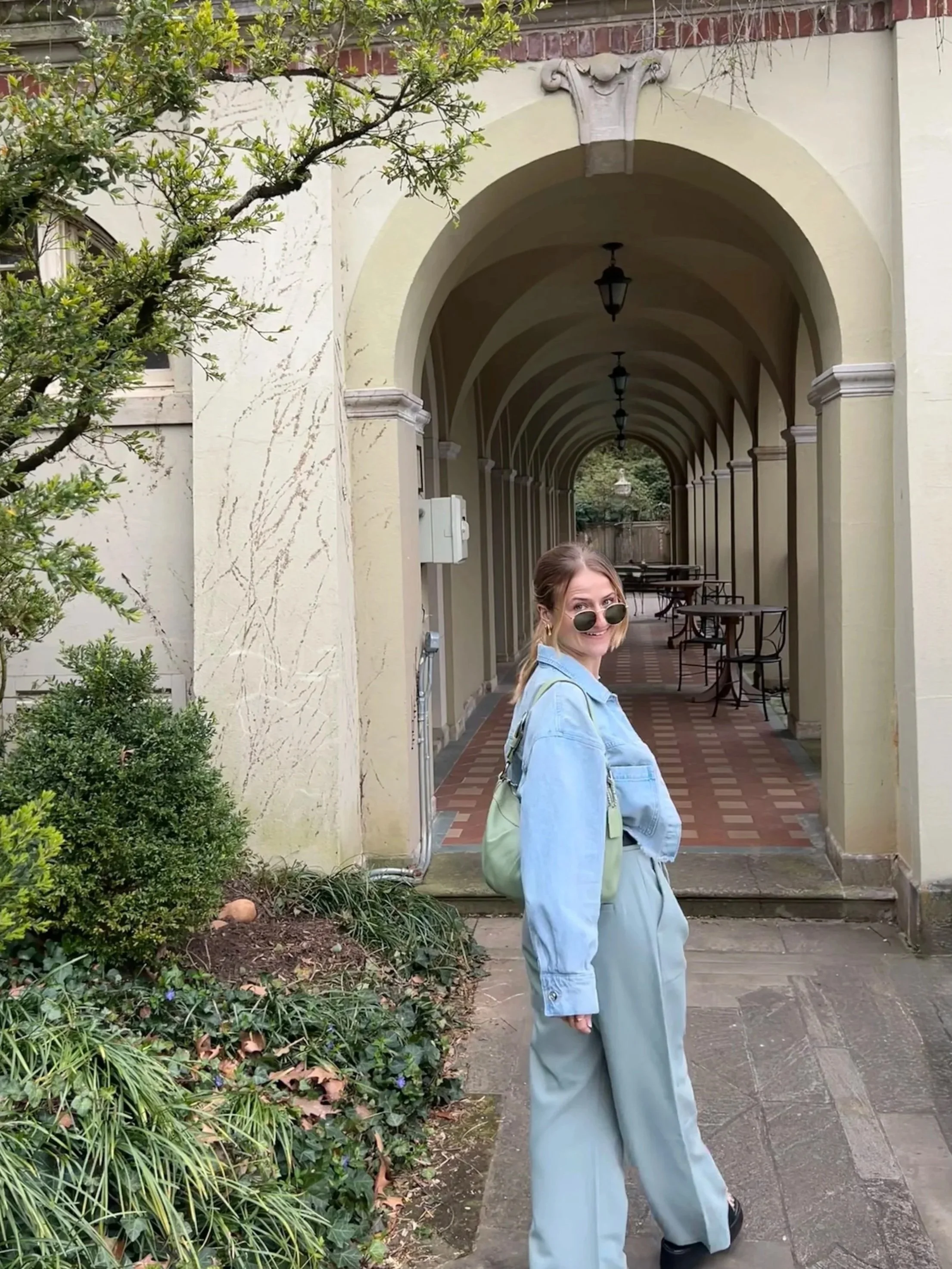 A photo of Lauren Roche in a garden