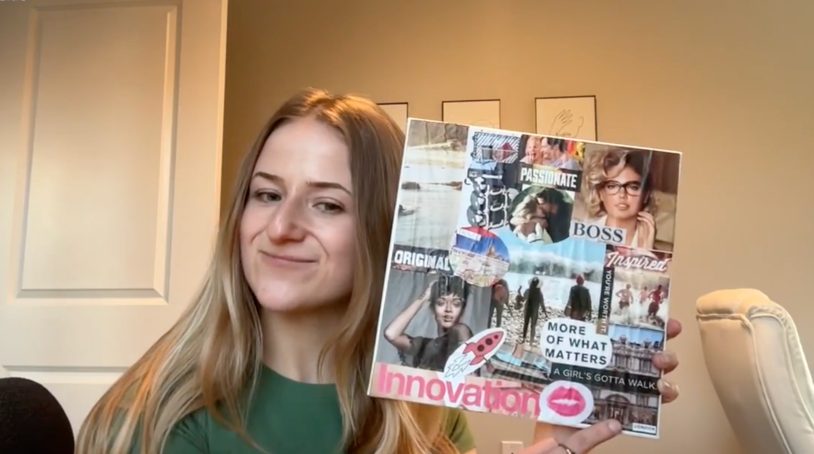 A photo of Lauren Roche holding her 2025 vision board