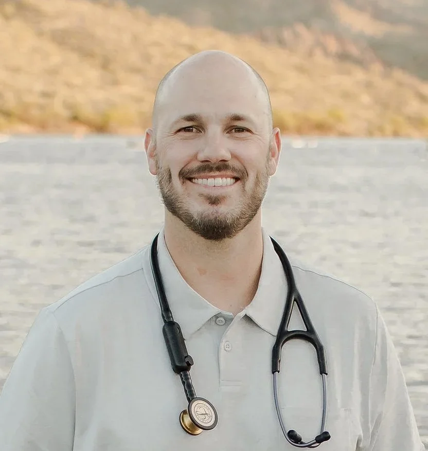 Professional headshot of Sean Fowler, Family Medicine and Direct Primary Care provider, smiling outdoors with a stethoscope.
