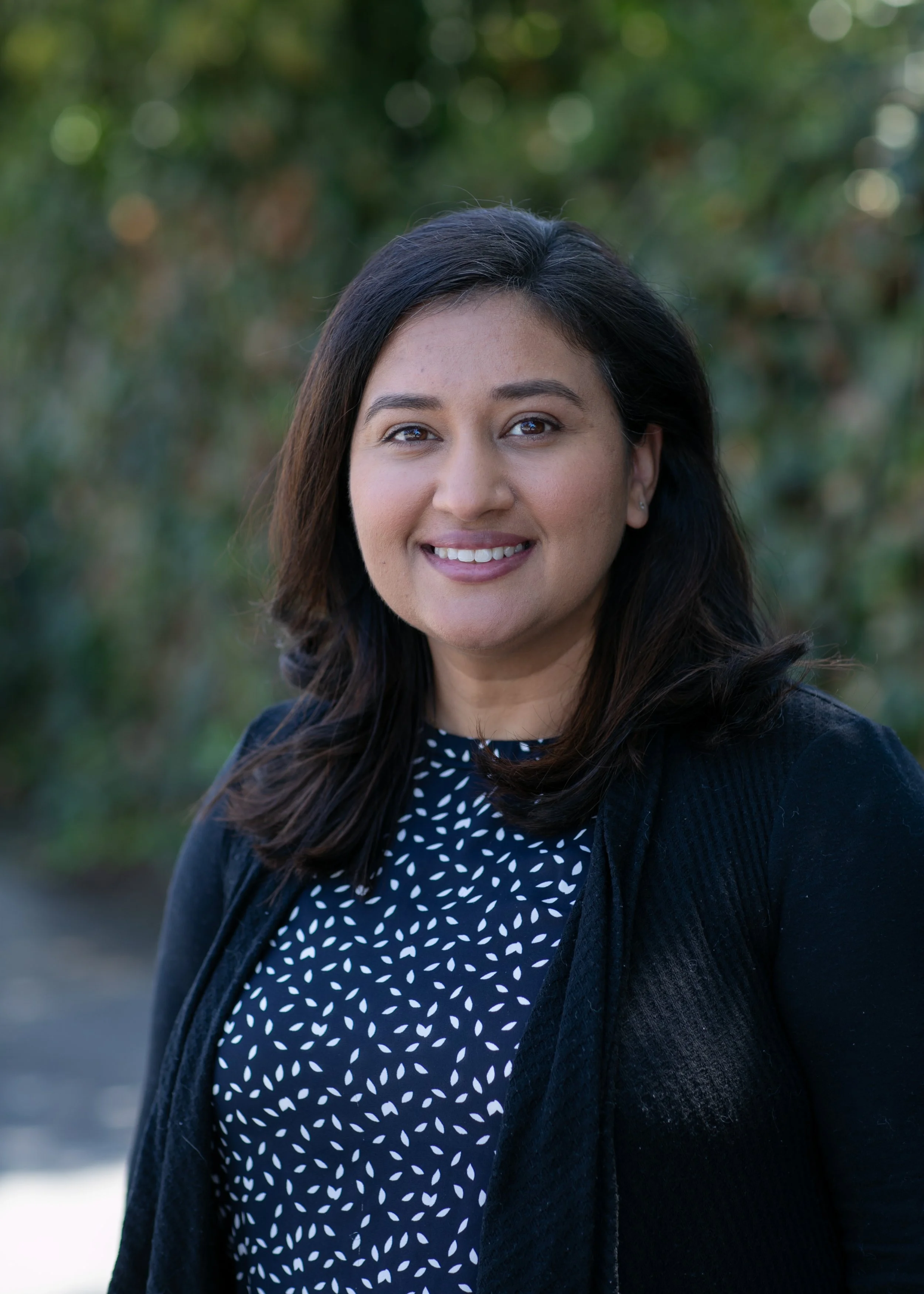 an image of Mandeep Kapur smiling at the camera