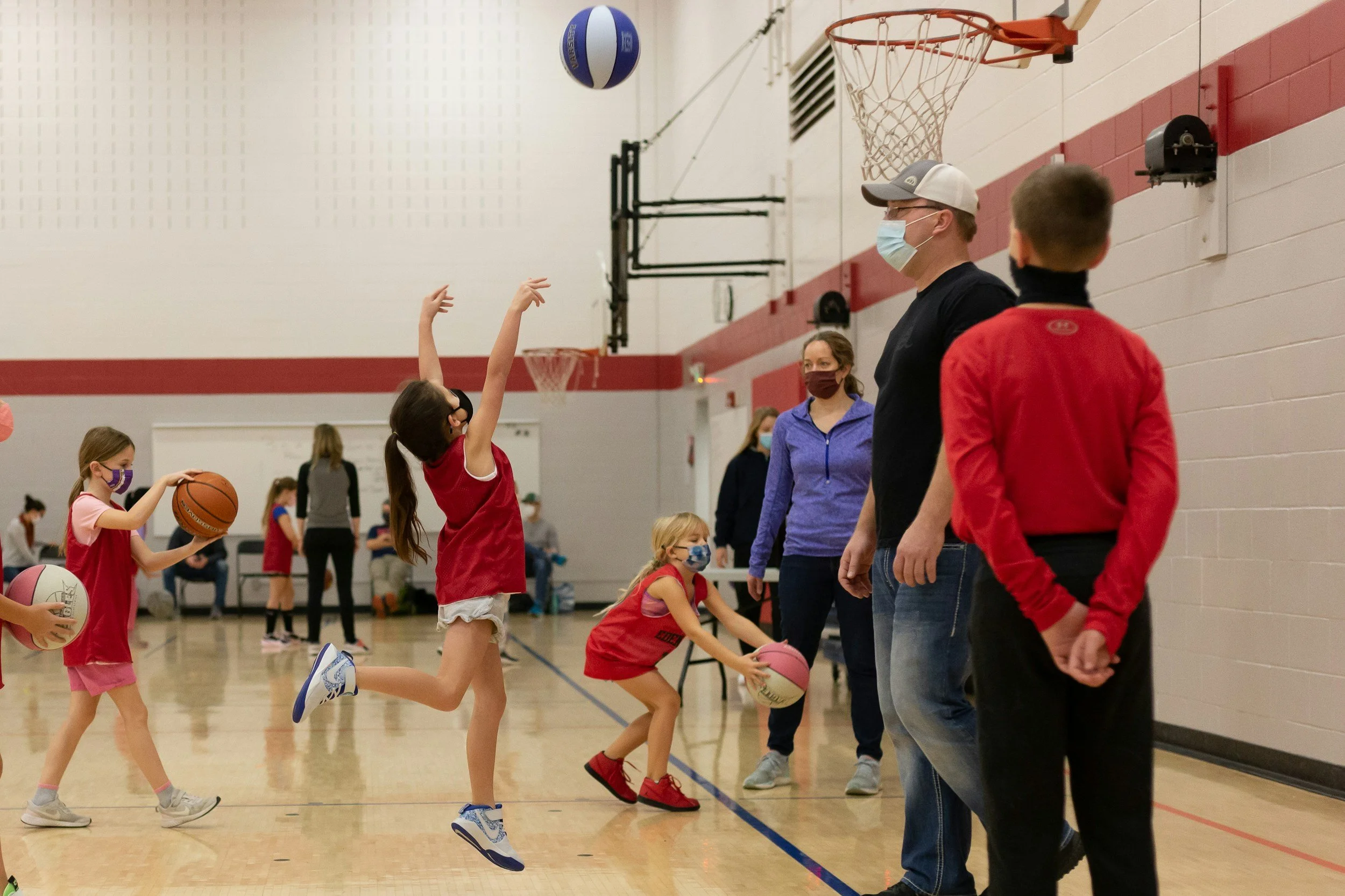 little girls playing basketball