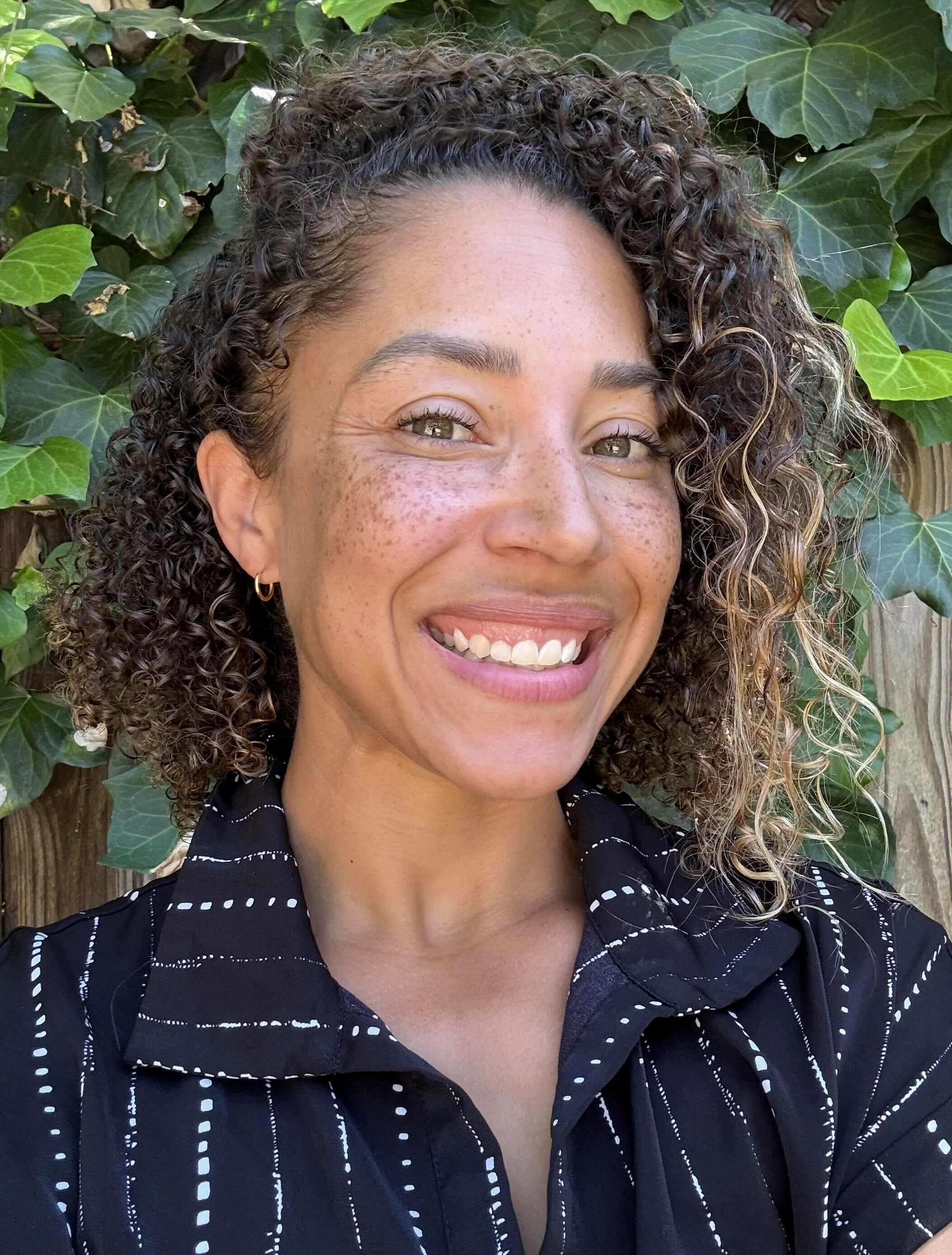 an image of Kendra Holmes smiling at the camera