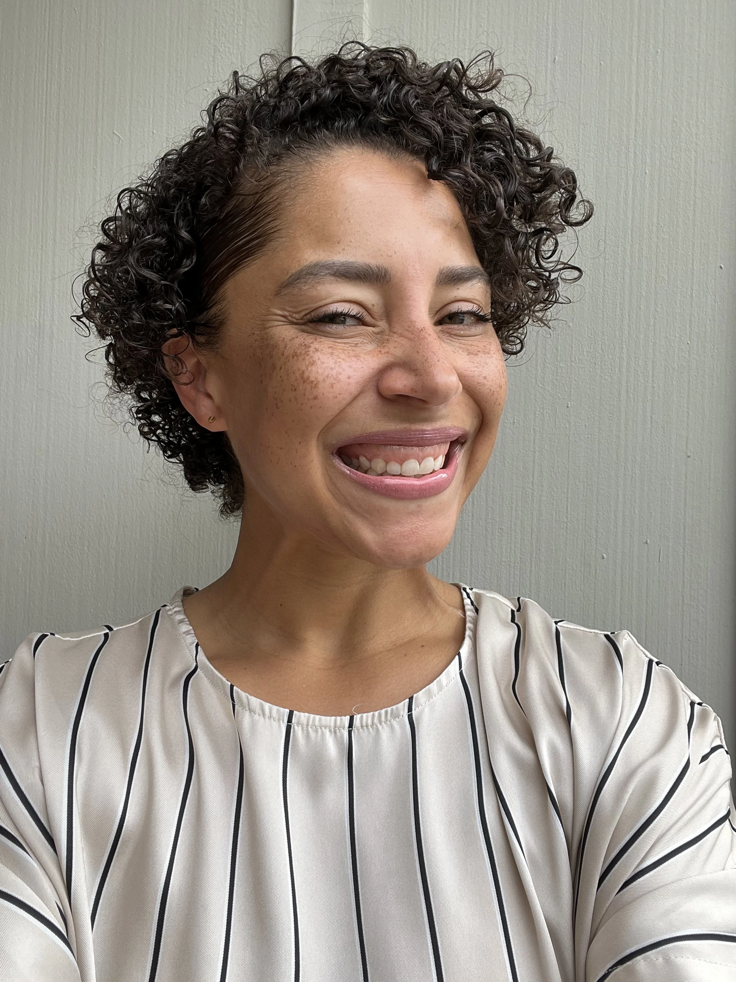 an image of Kendra Holmes smiling at the camera