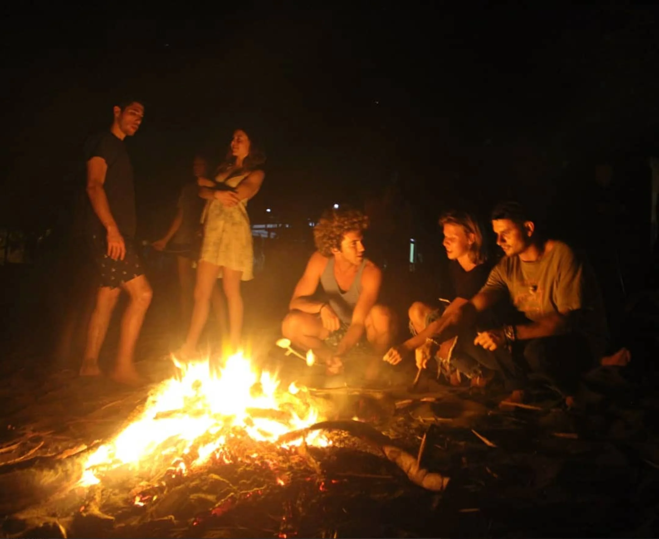 A bonfire on the beach with friends and family
