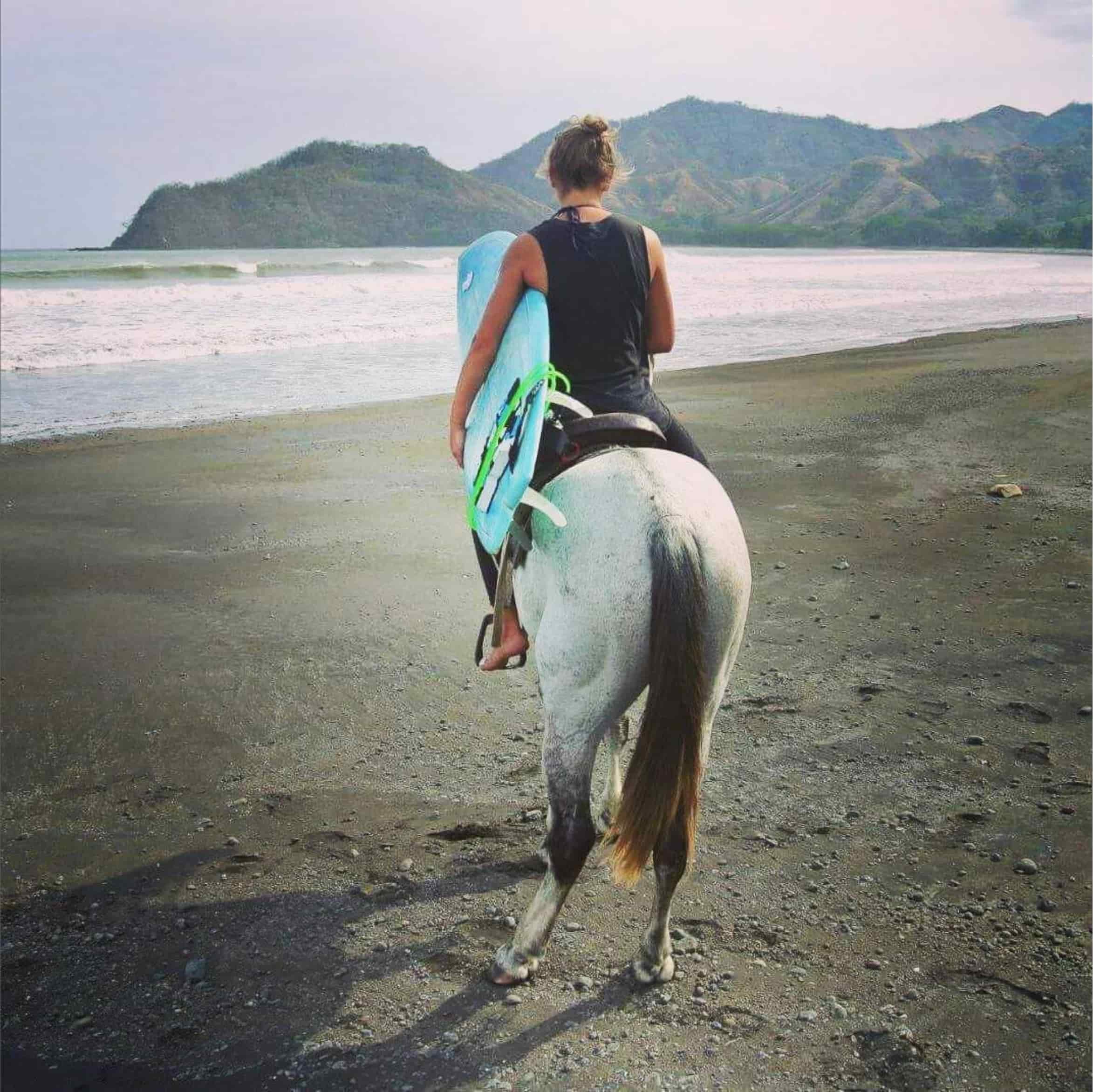 horseback riding on the beach at guanico beach resort