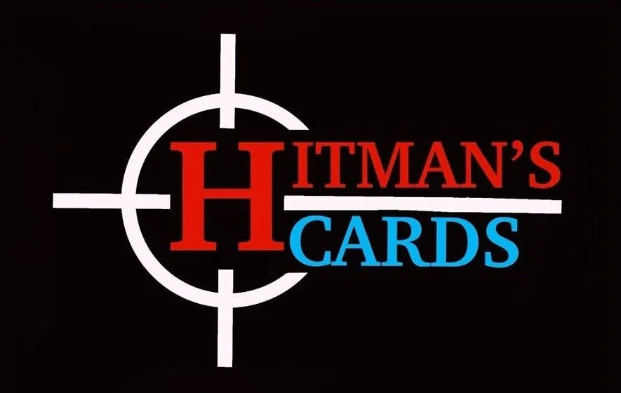 Logo with a target crosshair design featuring a large red letter 'H' and the words 'Hitman's Cards' with 'Hitman'' in red, 'Cards' in blue, on a black background.