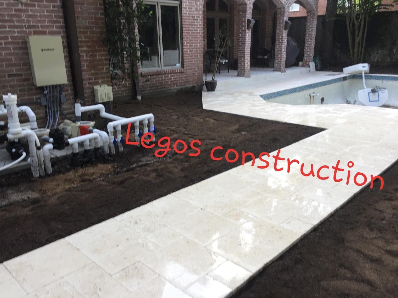 Decorative bone/white pavers for pool surrounding 