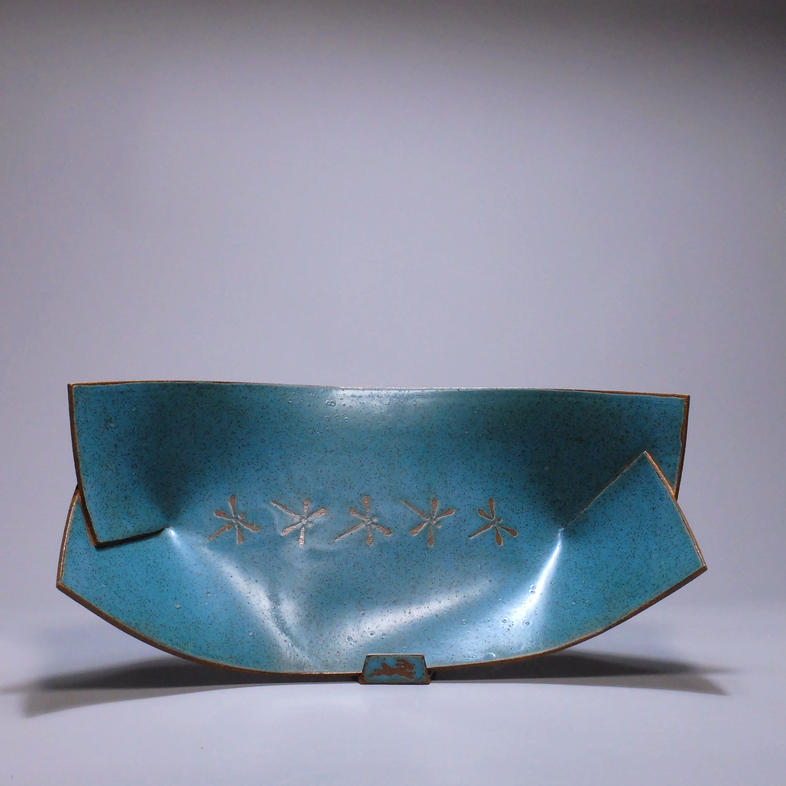 Big Boat, 2026. Speckled stoneware, turquoise matte glaze, dragonfly motif. 16.5"L, 8.5"W, 5.25"D.